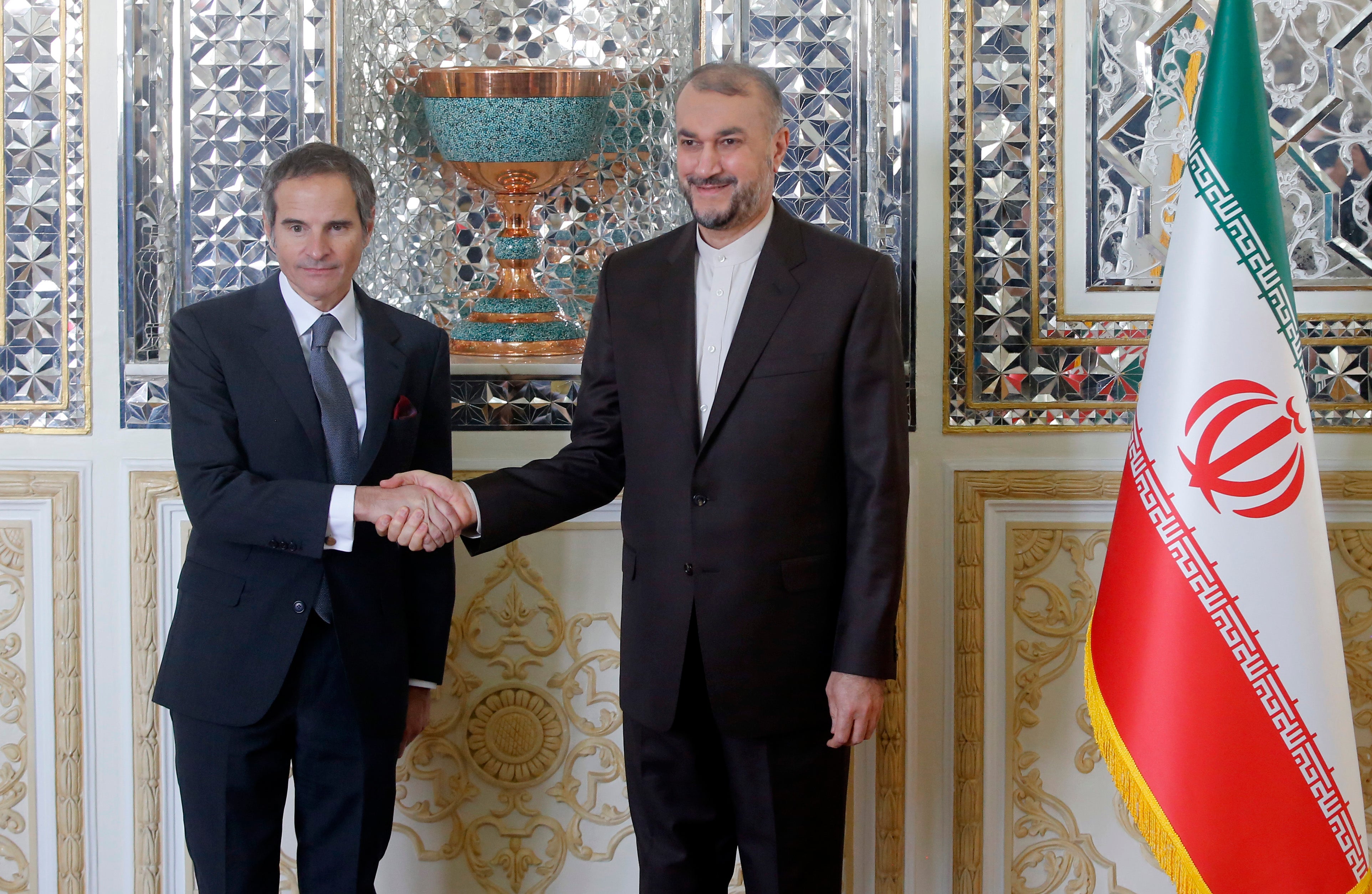 Iranian Foreign Minister Hossein Amir-Abdoulahian welcomes Rafael Grossi (left), director general of the International Atomic Energy Agency (IAEA), in Tehran