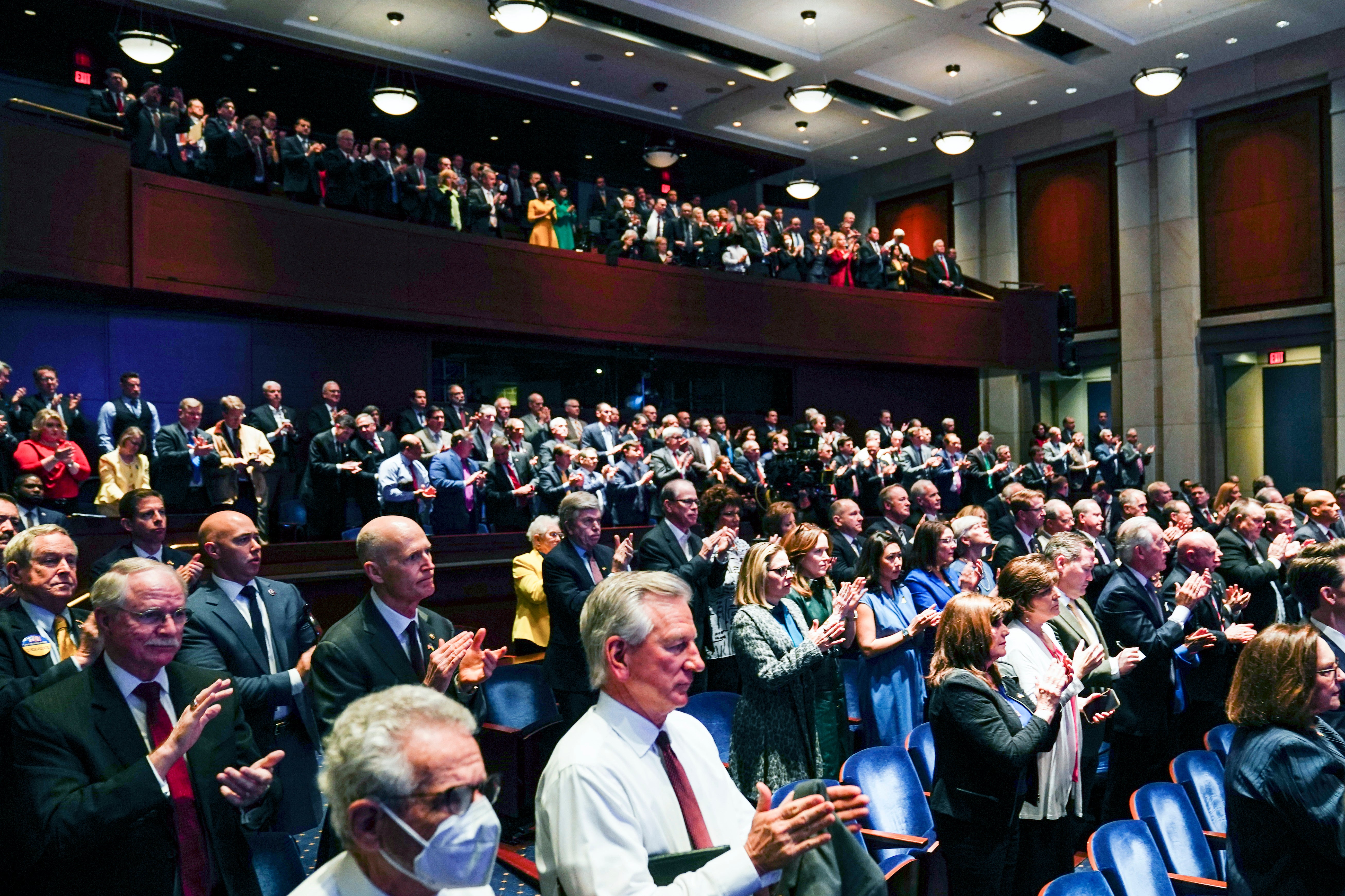 Members of Congress applaud as Ukrainian President Volodymyr Zelenskyy delivers a virtual address to Congress by video at the Capitol in Washington, Wednesday, March 16, 2022. (Sarah Silbiger, Pool via AP)