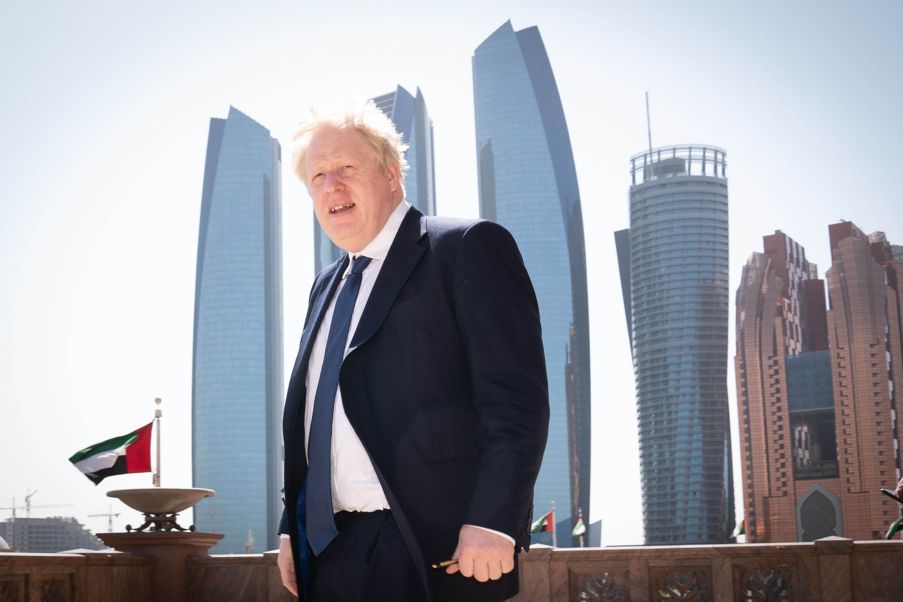 Prime Minister Boris Johnson arrives for a media interview at the Emirates Palace hotel in Abu Dhabi during his visit to the United Arab Emirates