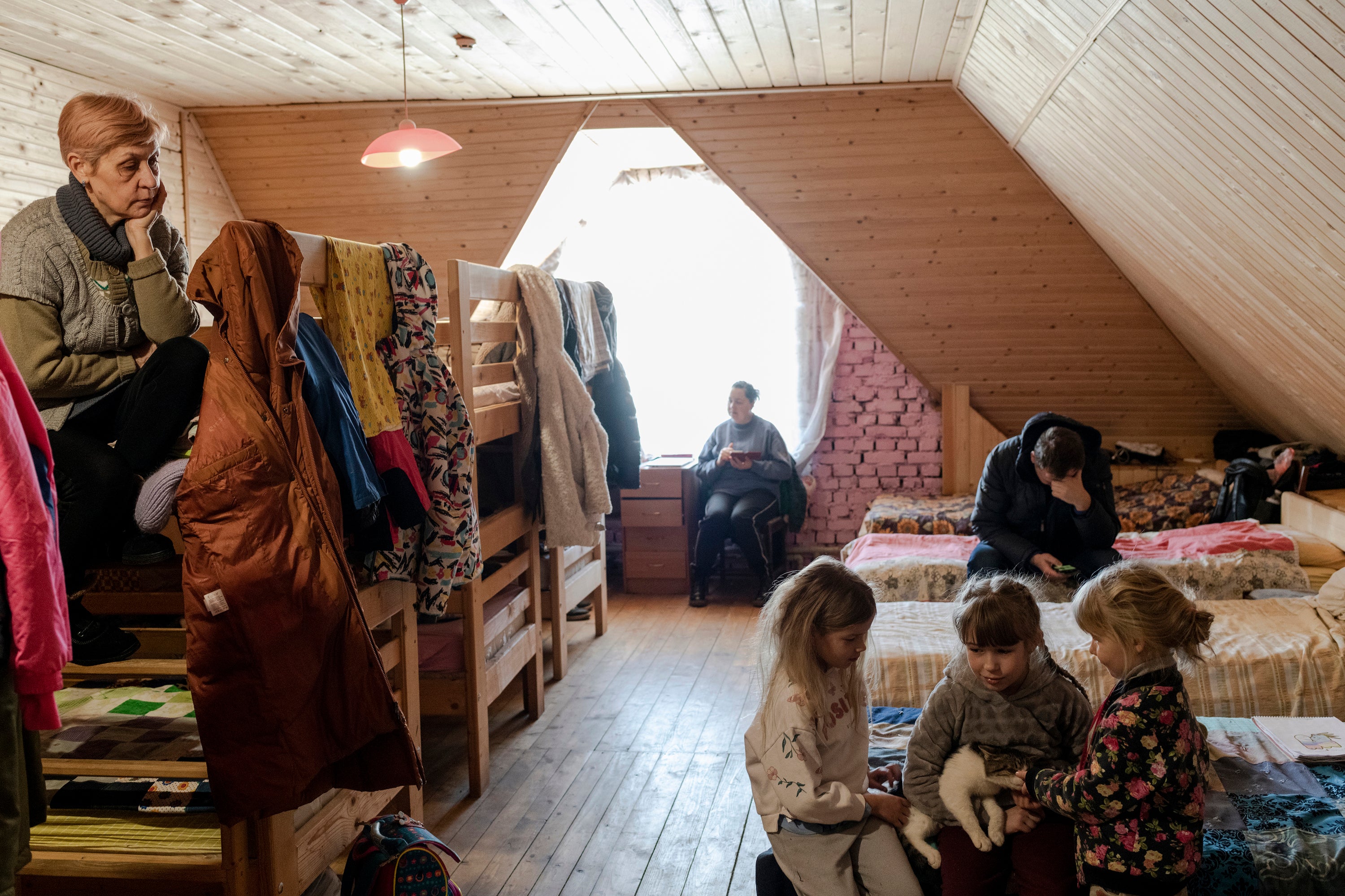 Svitlana Yanchuk, left, came with her daughters and their children from Bila Tserkva to the Carpathian mountains. It is safe and close to the border with Poland, where they hope to go next