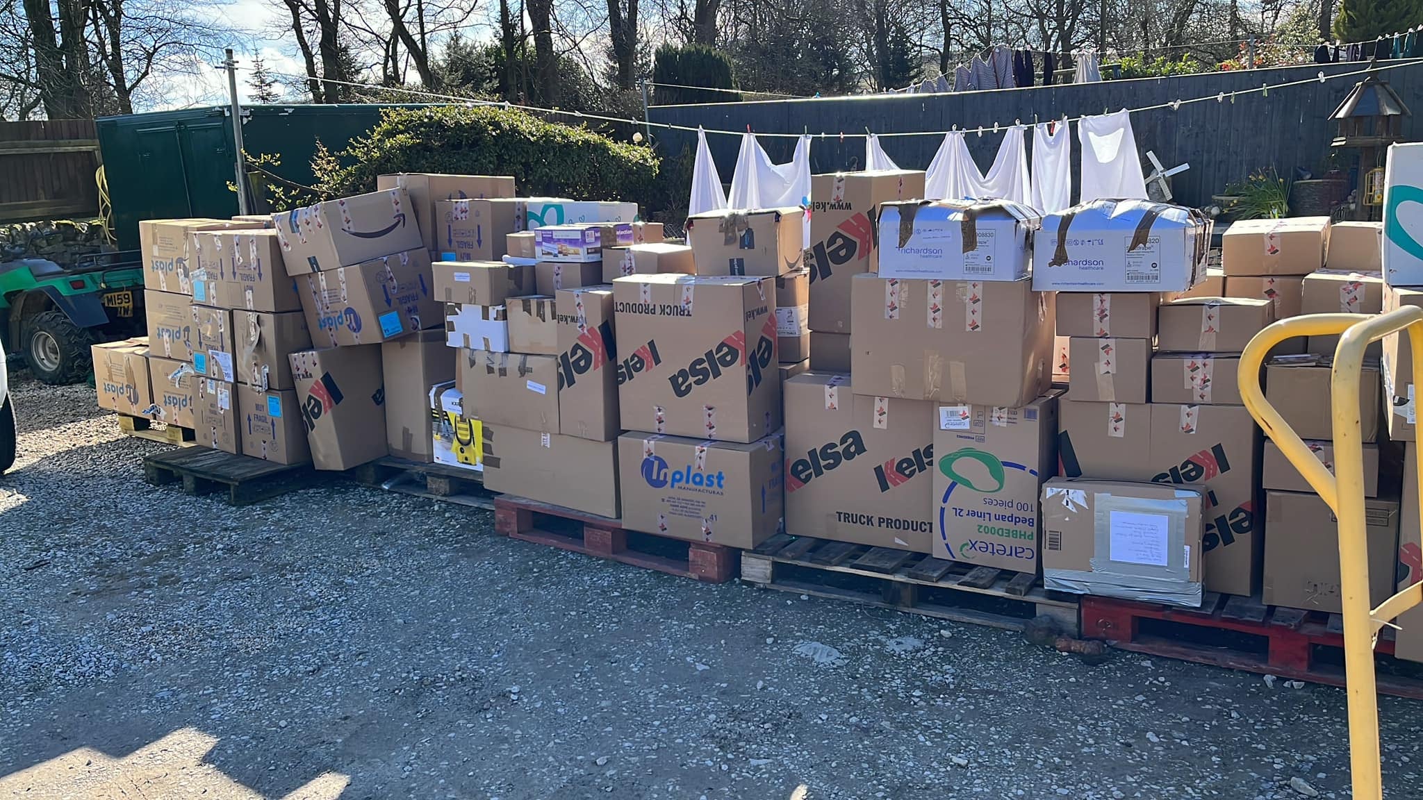 Boxed donations at a farm in Buxton to be transported to the Ukraine-Poland border in horse boxes (Mark Caley/PA)