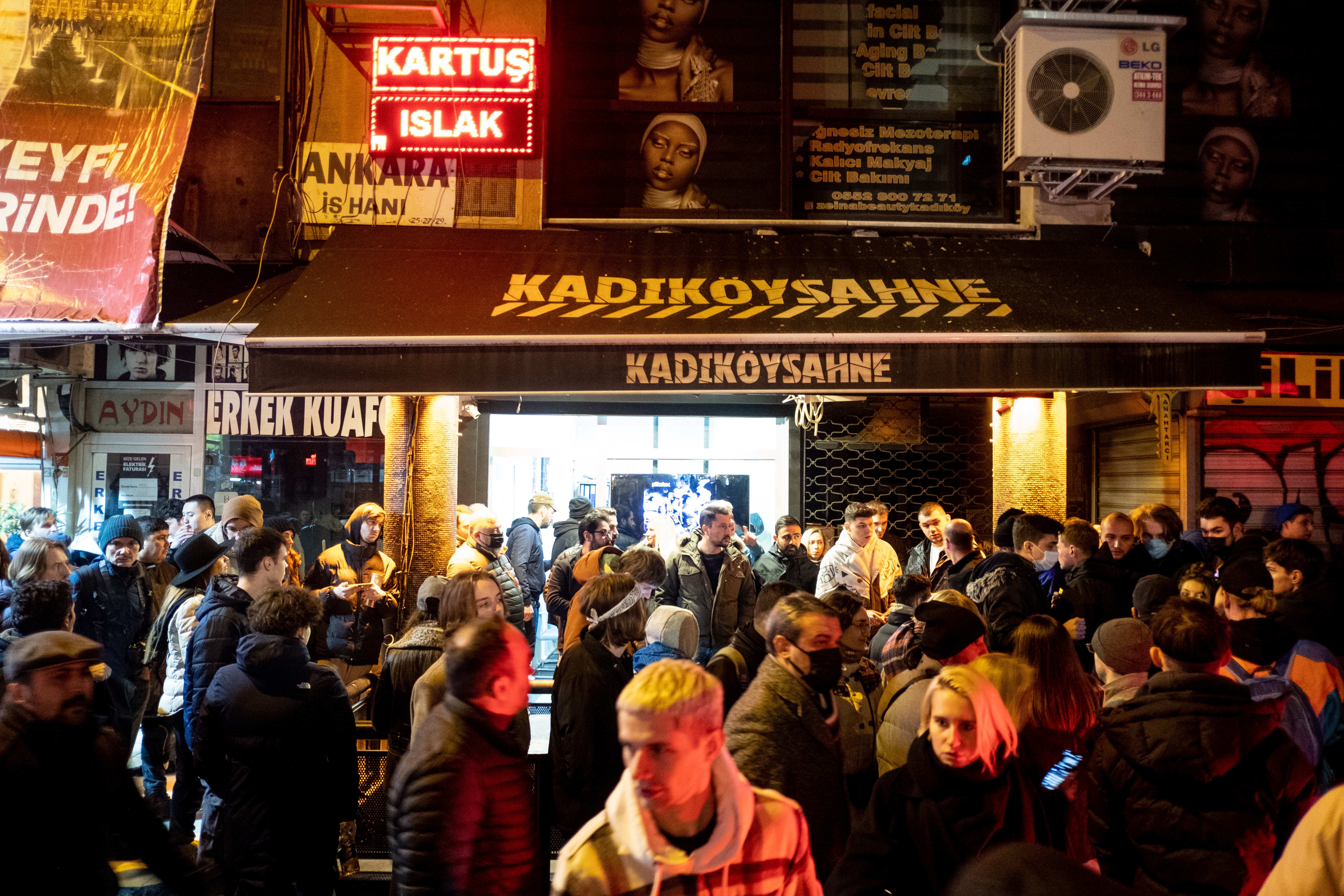 Russians and others gather near a venue hosting an anti-war rap concert in Istanbul