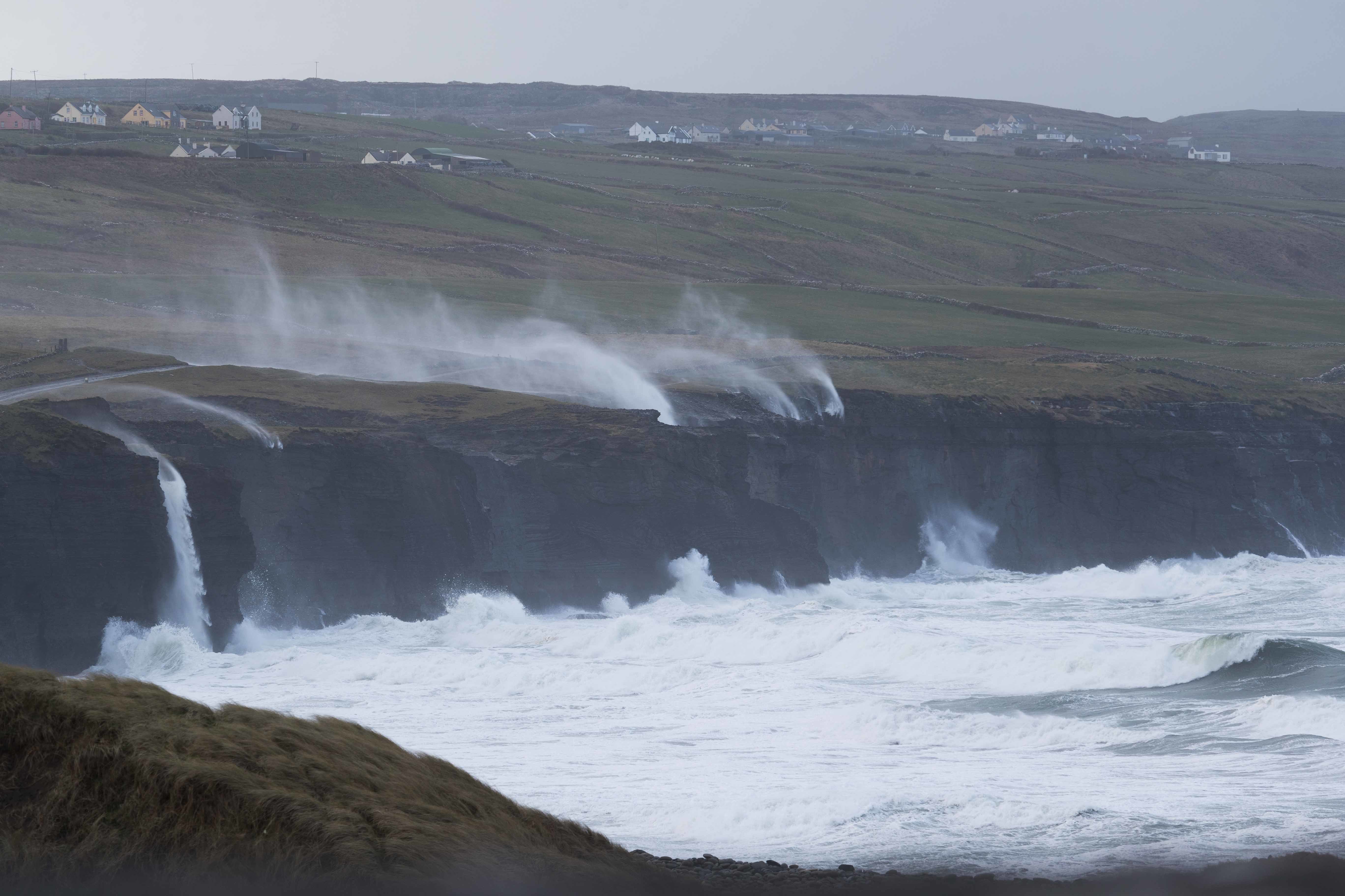 Water is blown back on to the land near Doolin, Co Clare, as Storm Eunice raged across Ireland last month. Extreme weather is one impact of the worsening climate crisis