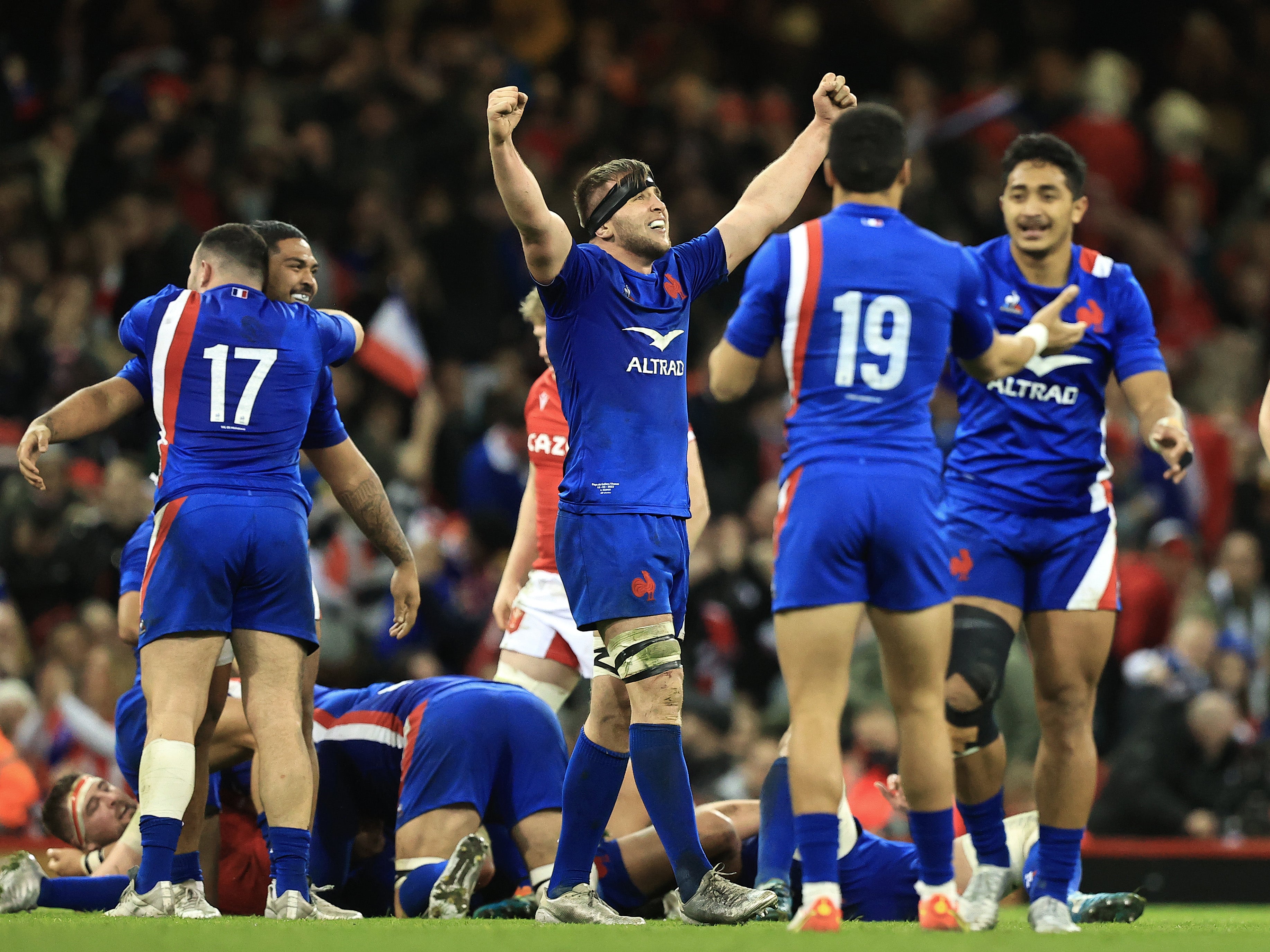 France celebrate at full time following their Six Nations win in Cardiff