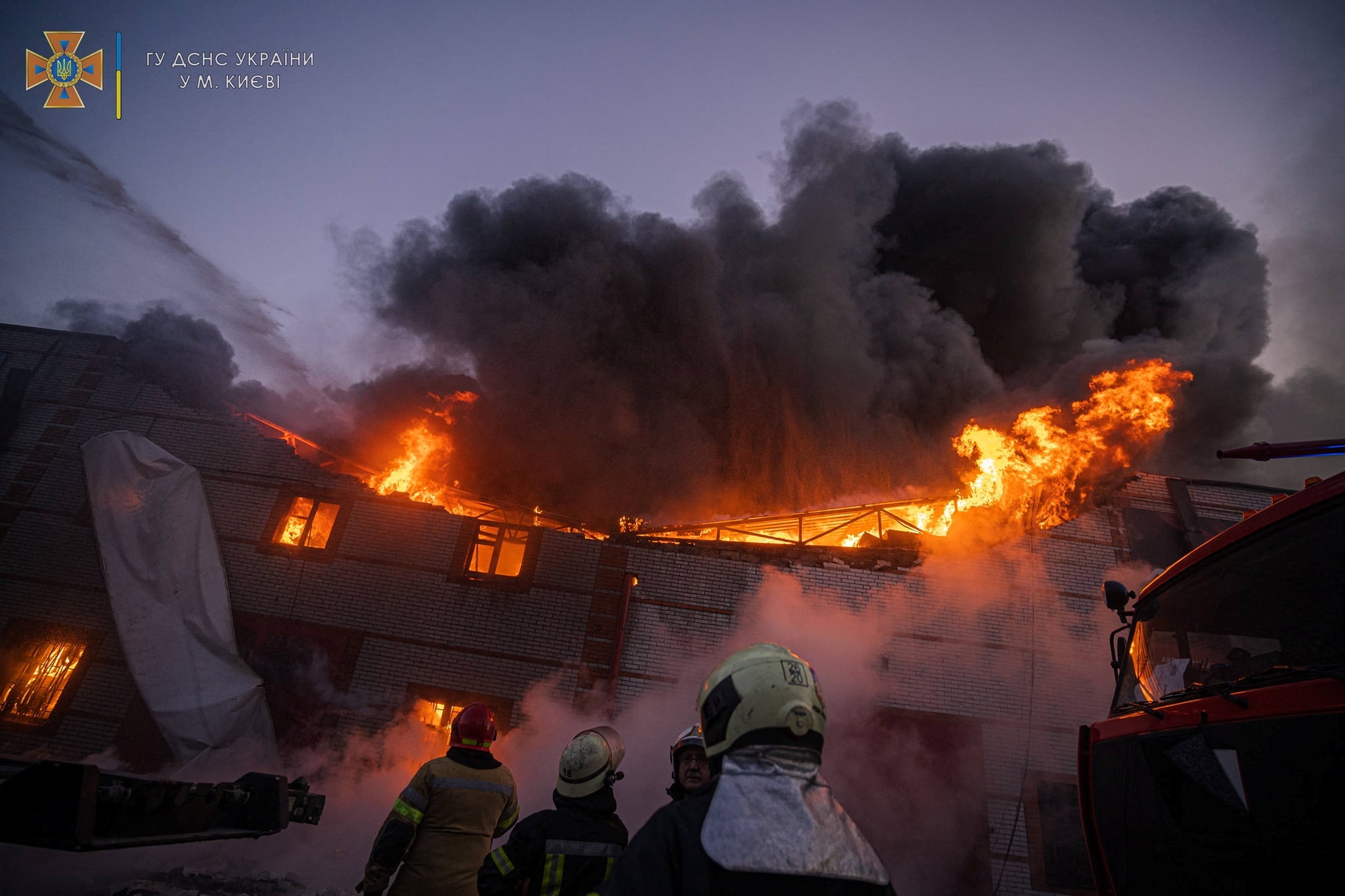 Rescuers work at a site of buildings damaged by a shelling in Kyiv