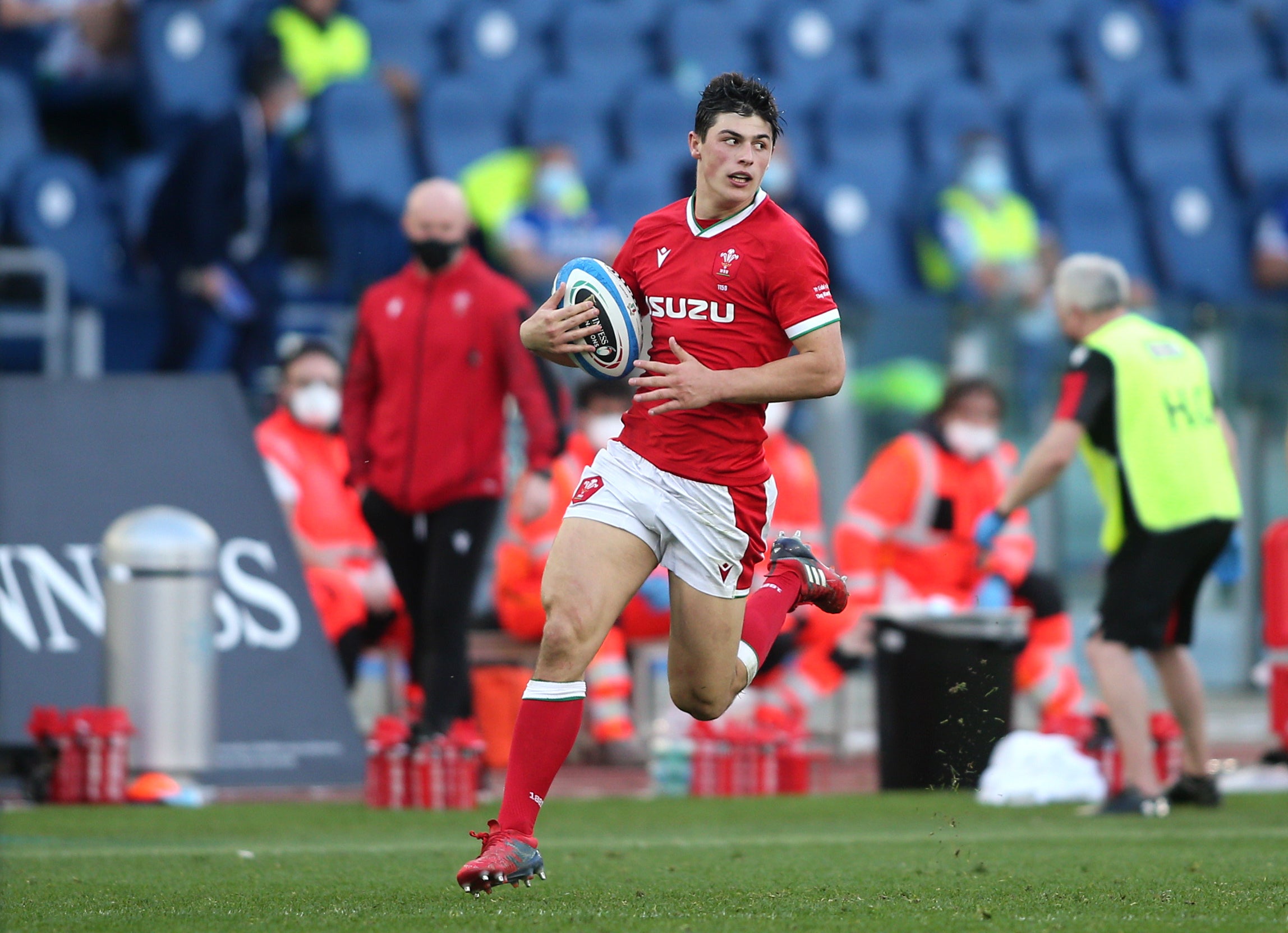 Wales wing Louis Rees-Zammit runs in a try against Italy last season (Marco Iacobucci/PA)