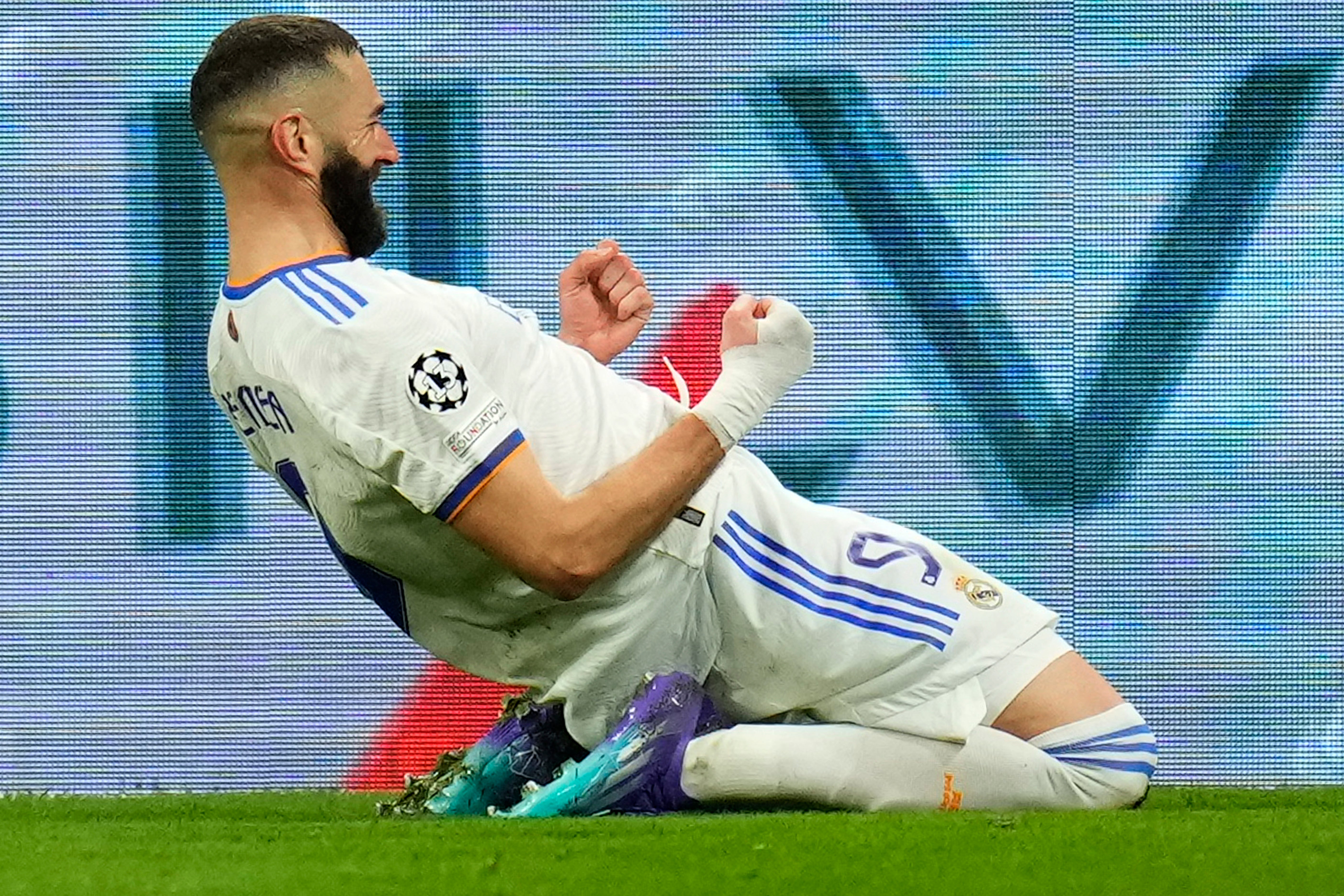 Karim Benzema celebrates scoring Real Madrid’s third goal against PSG (Manu Fernandez/AP)