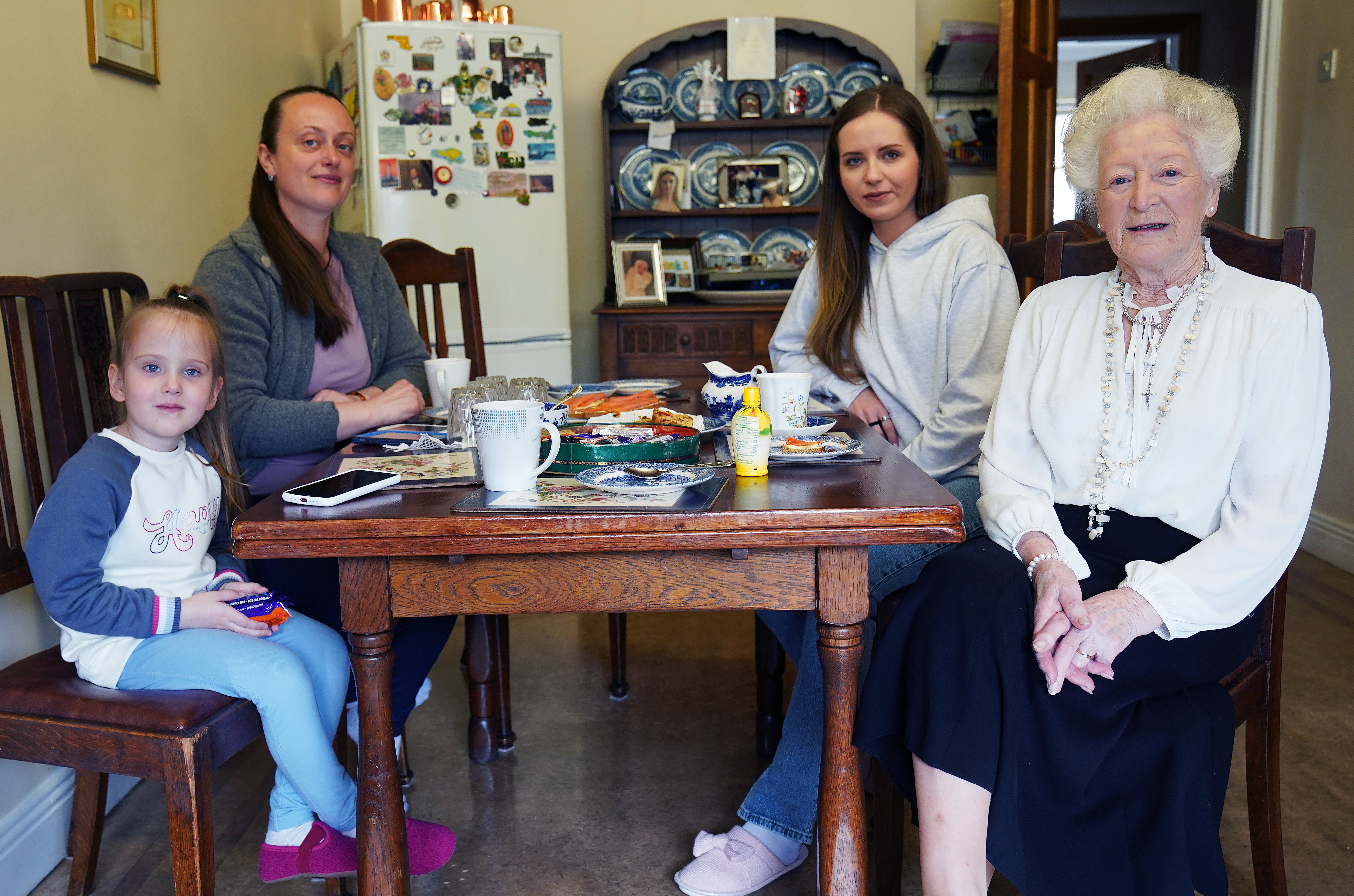 Phyliss McDonagh with Viktoria Kasianenko (back left), her four-year-old daughter Barbara Yevlakhova and step-daughter Anna Yevlakhova, 32, at her home in Dublin (Brian Lawless/PA)