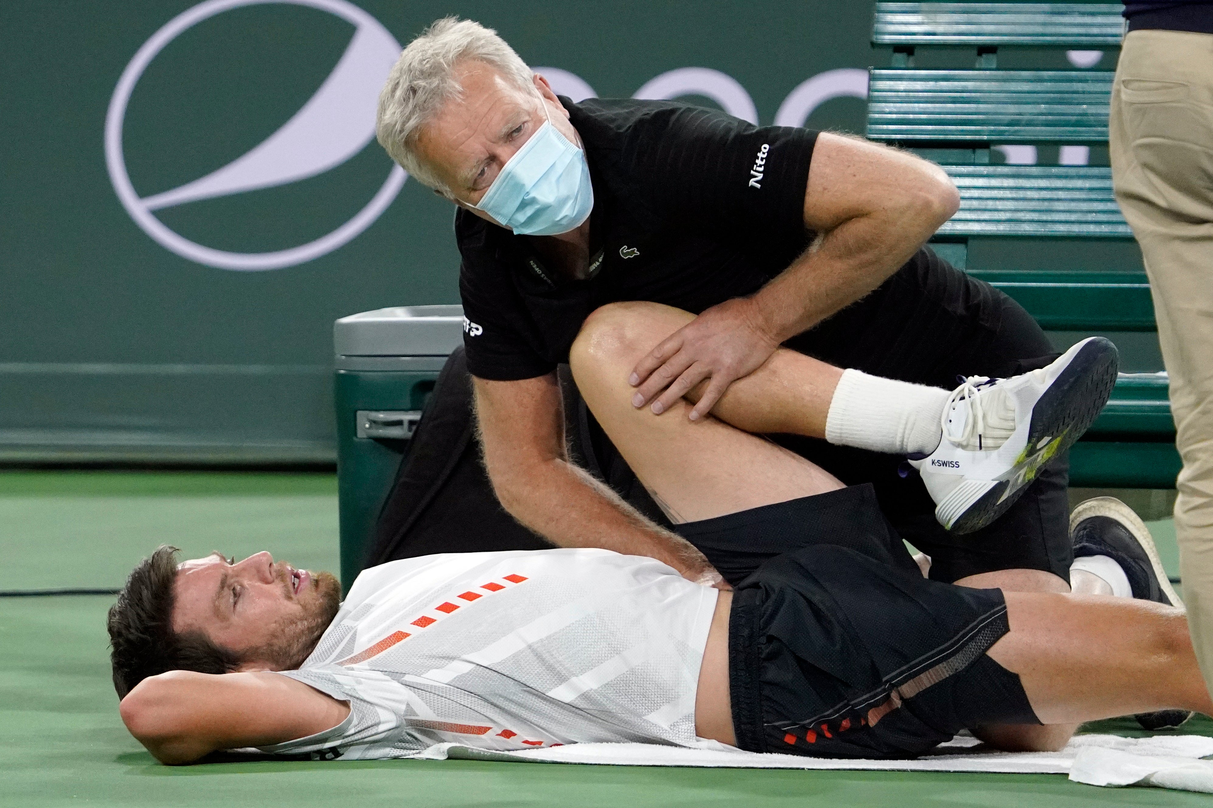 Cameron Norrie needed treatment for a sore hip during his loss to Carlos Alcaraz (Mark J Terrill/AP)