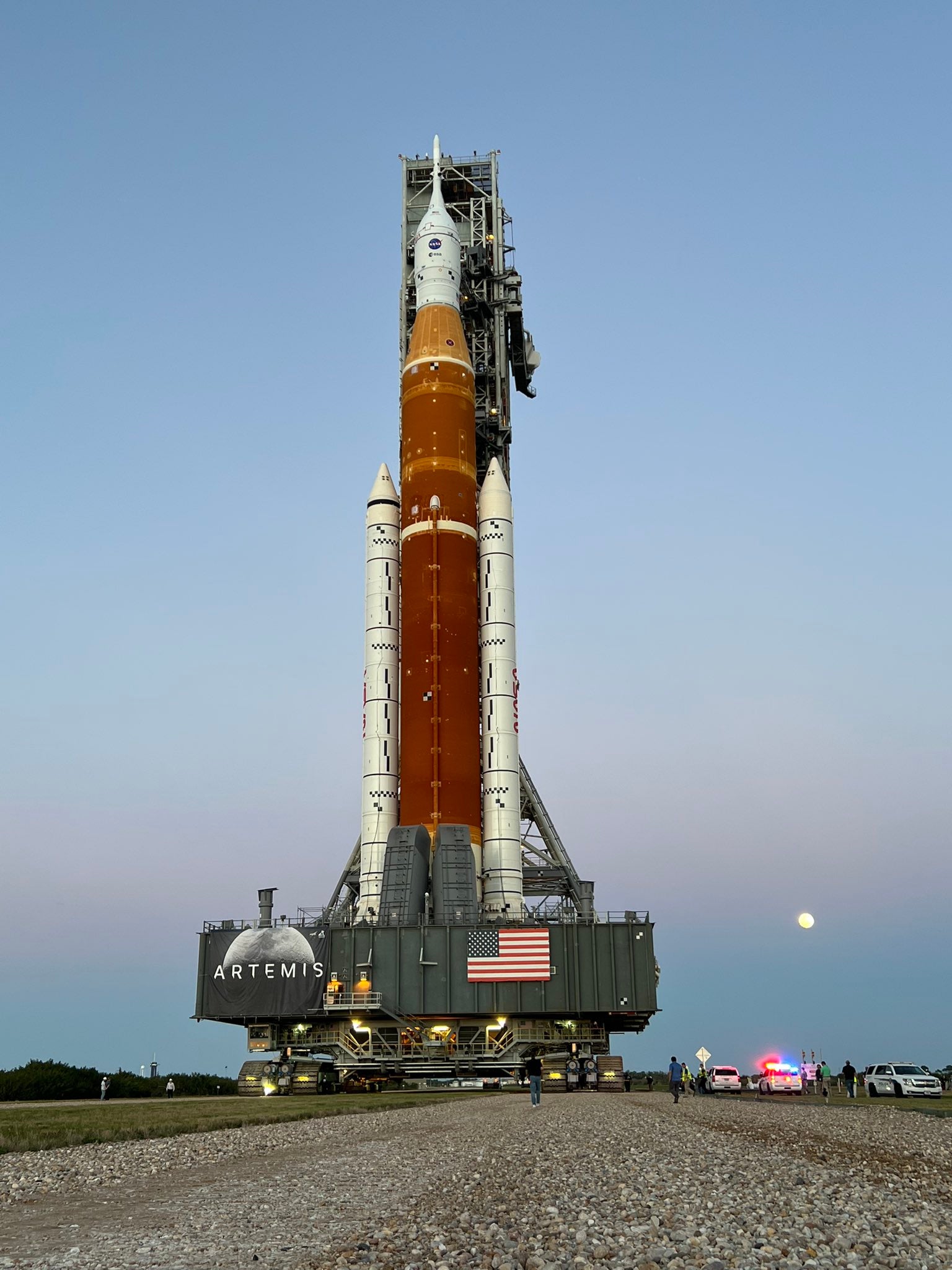 Nasa’s new Moon rocket, the Space Launch System, rolls to the launchpad under moonlight.