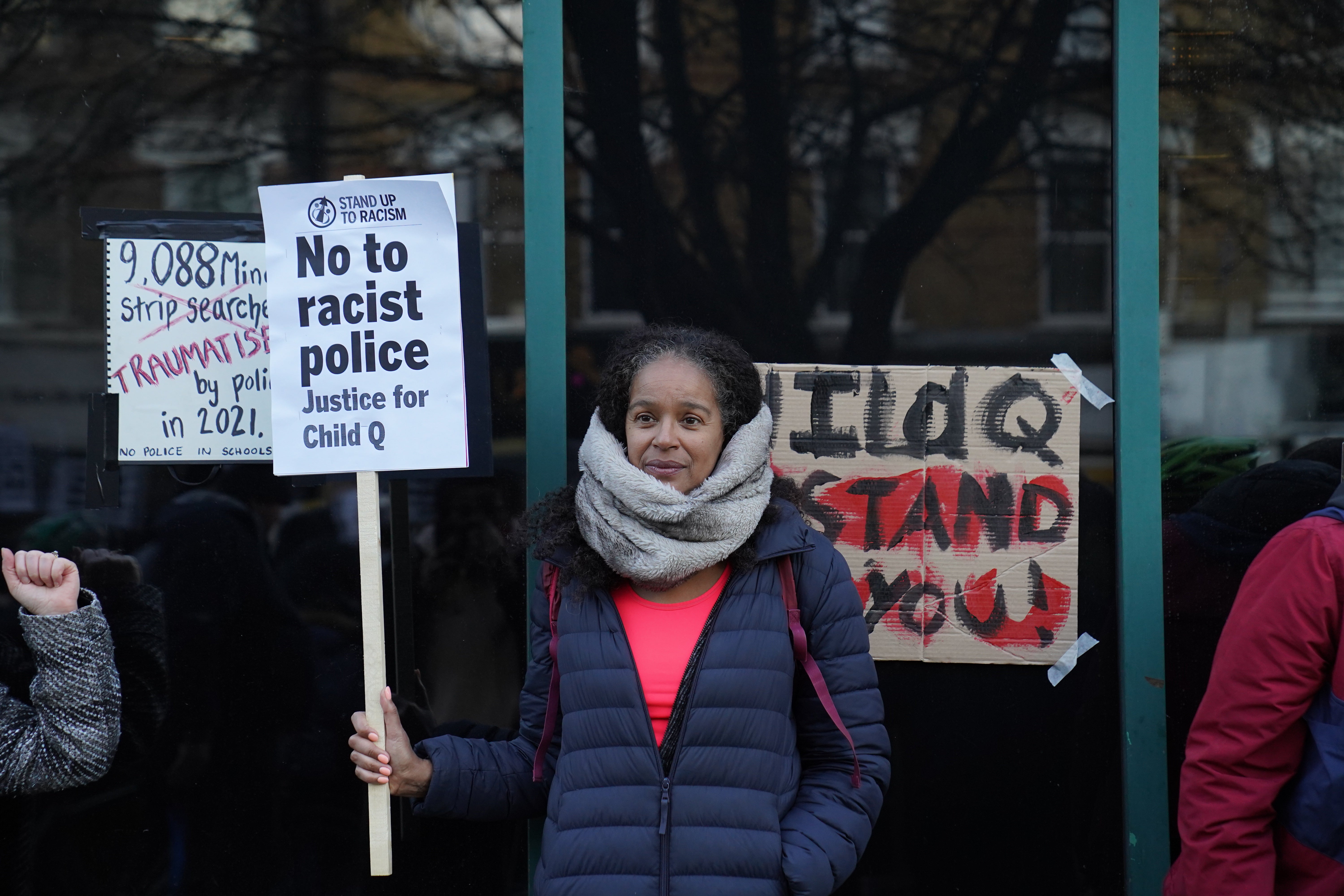 A woman’s sign reads ‘No to racist police. Justice for Child Q’ at March’s protest