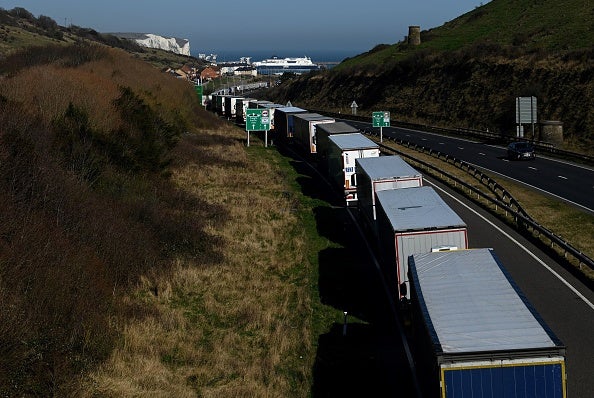 Freight lorries and HGVs queue on the road towards the Port of Dover after P&O halted sailings, causing long backlogs.