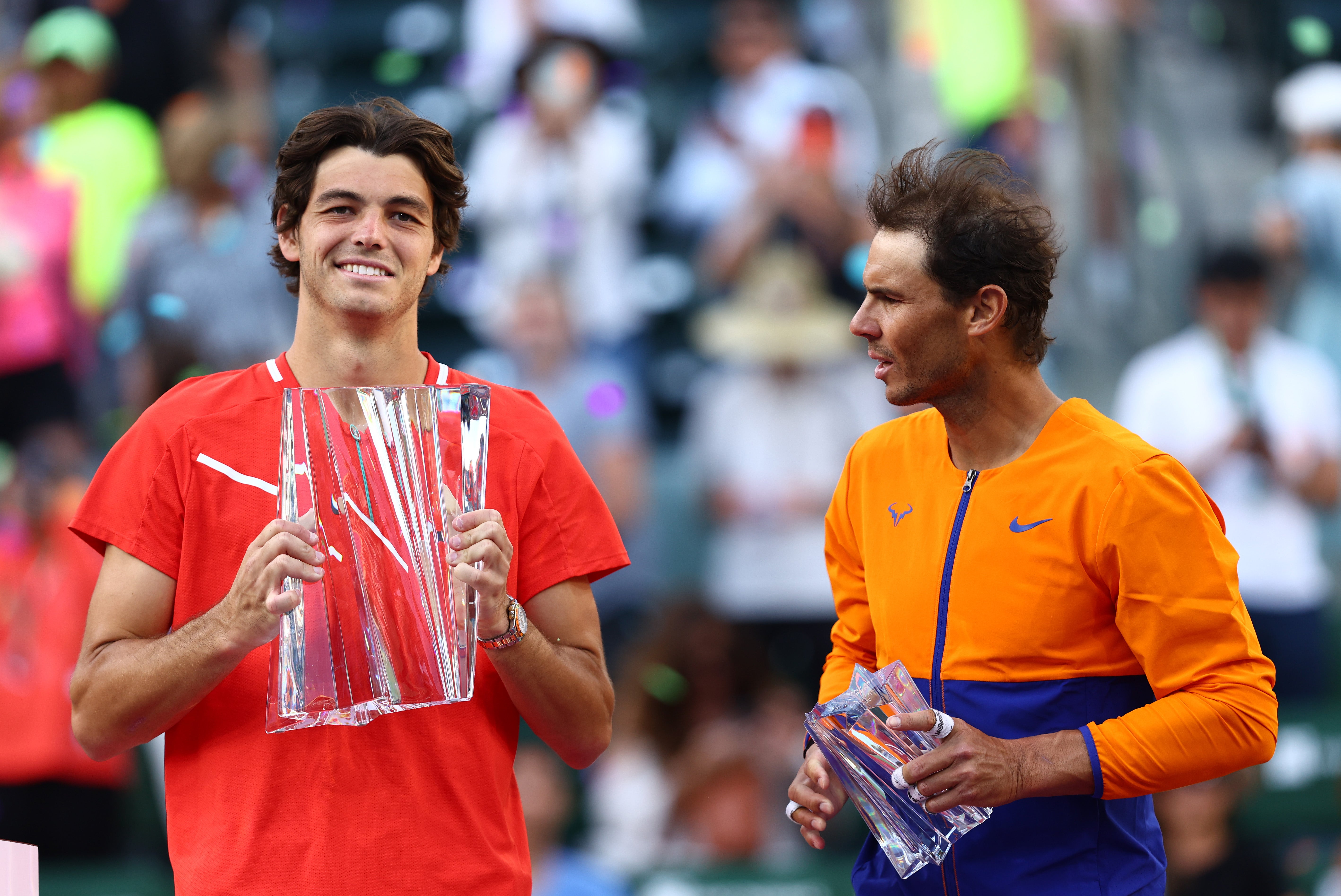 Taylor Fritz of the United States holds his winners trophy