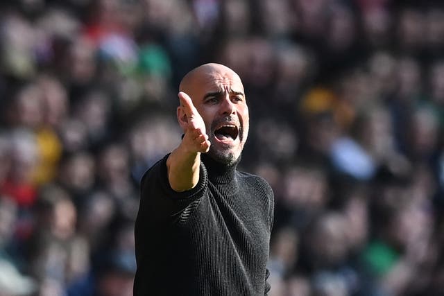 <p>Pep Guardiola signals from the touchline</p>