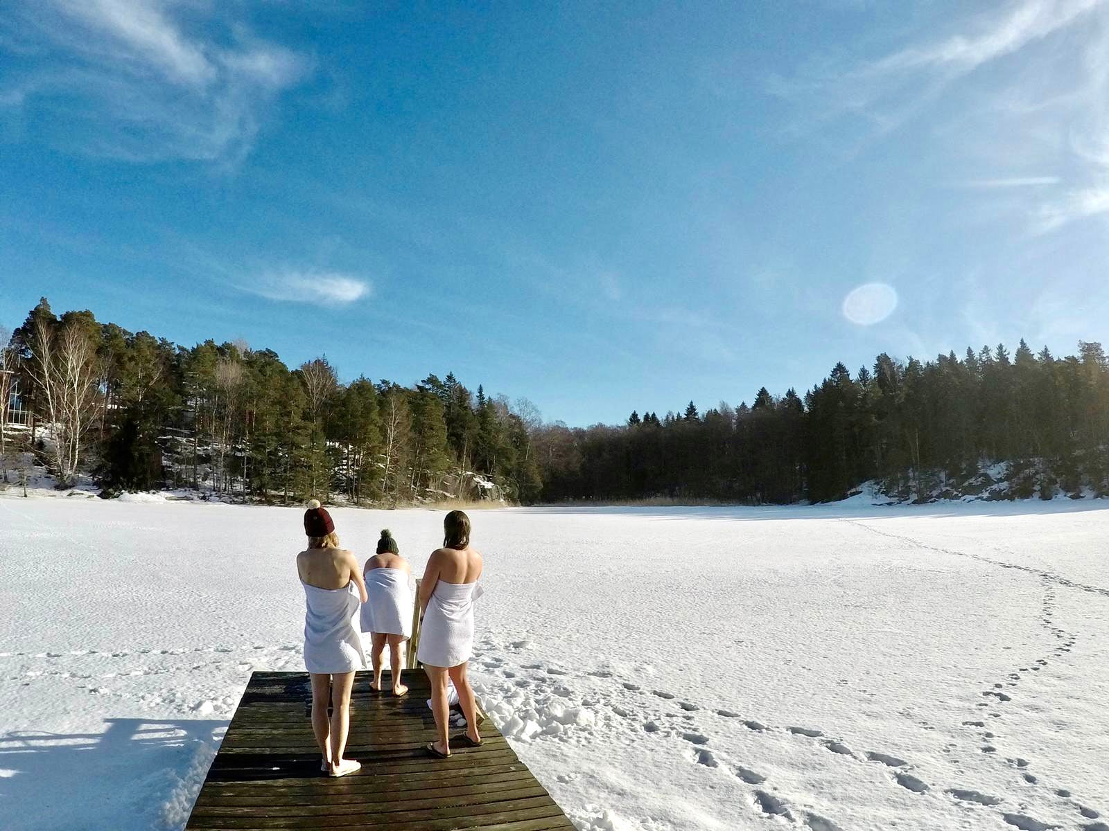 Three nude swimmers at a female-only sauna and swim session of Kuuma