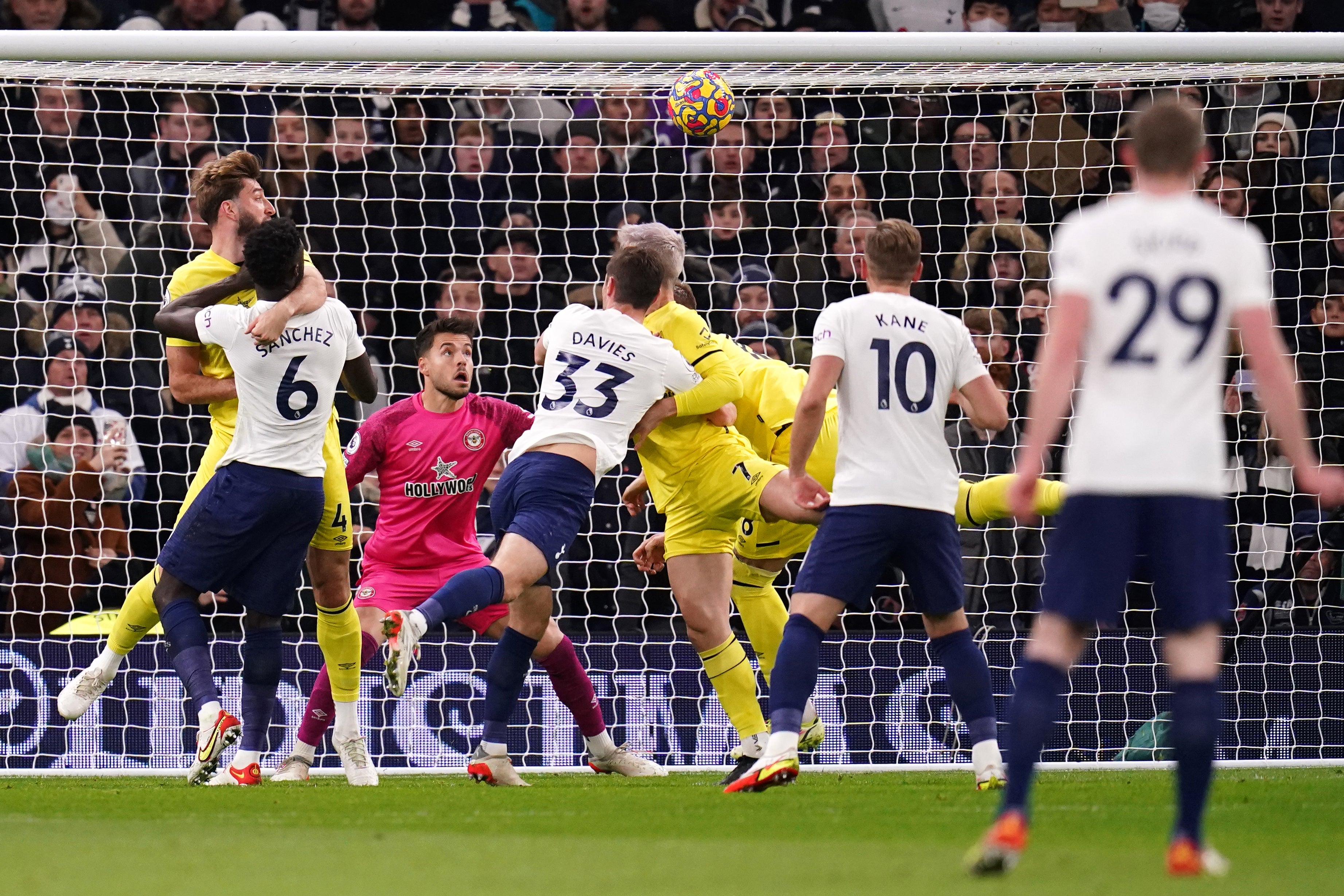 Sergi Canos, centre, scores an own goal to put Tottenham ahead (John Walton/PA)