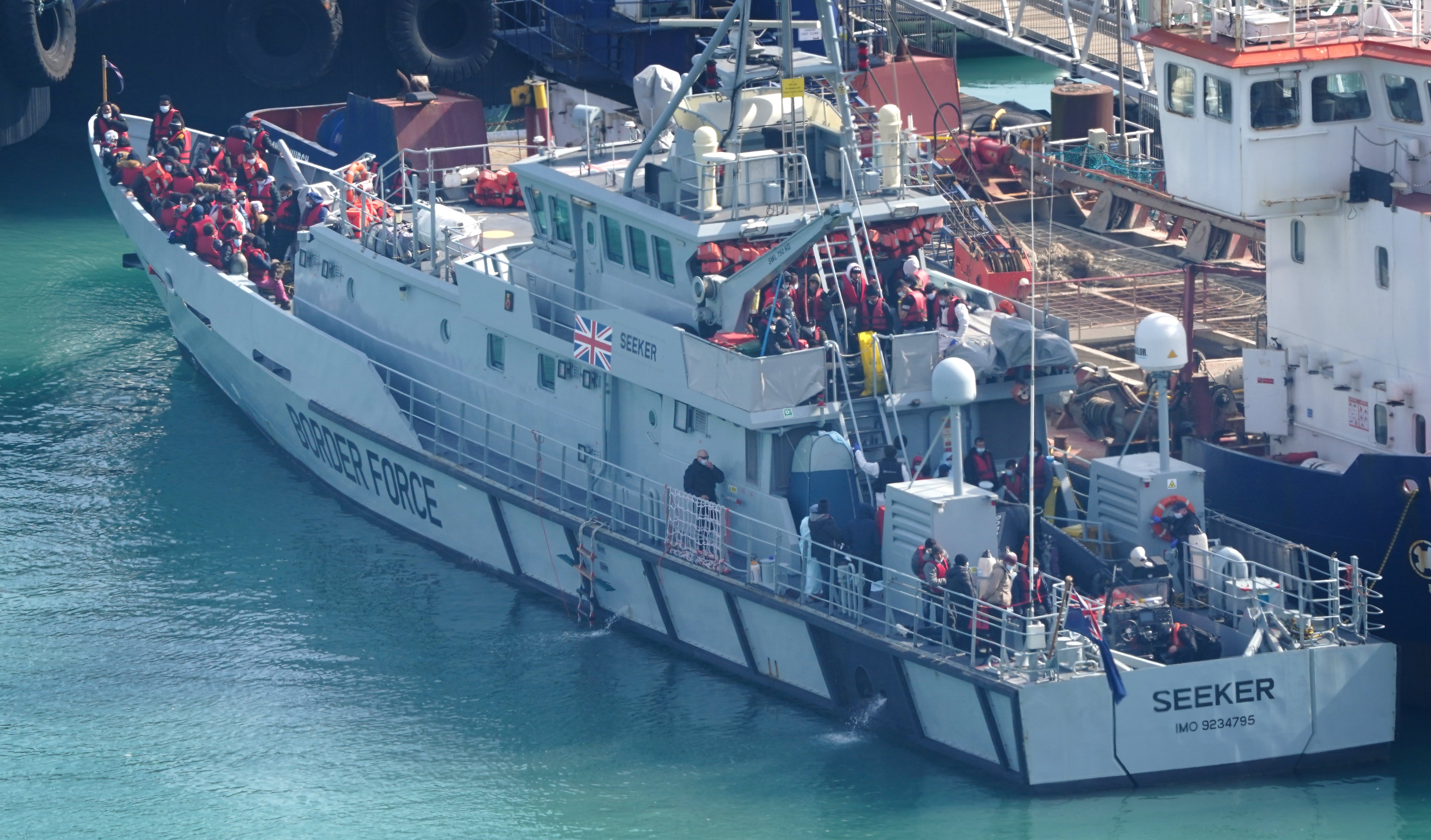 A group of people thought to be migrants are brought in to Dover, Kent, onboard a Border Force vessel following a small boat incident in the Channel (Gareth Fuller/PA)