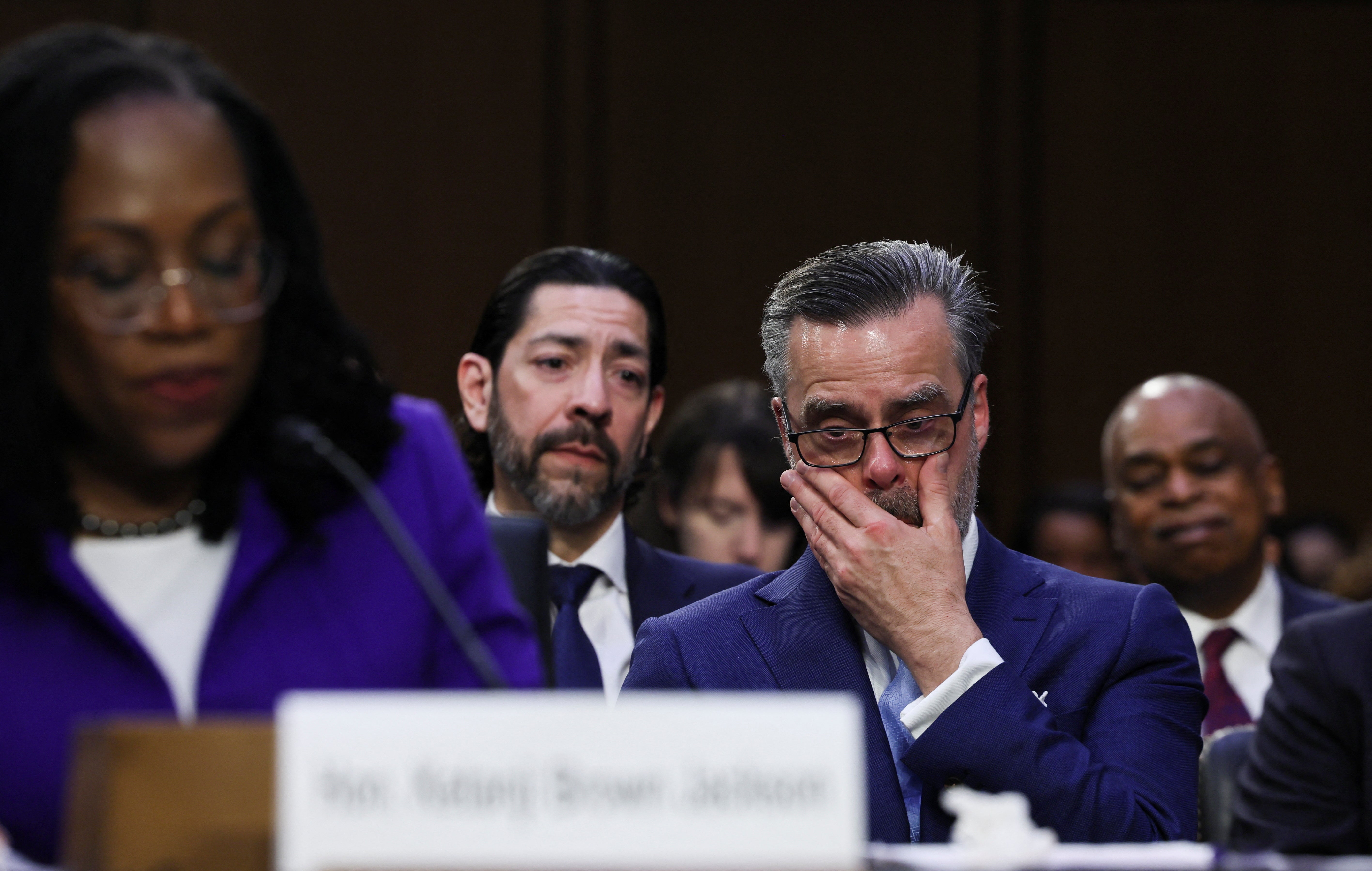 Patrick Jackson cries as he watches his wife, Judge Ketanji Brown Jackson, deliver her opening statement to the U.S. Senate Judiciary Committee during the first day of the confirmation hearing on her nomination to the U.S. Supreme Court, on Capitol Hill