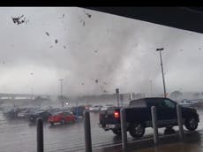 Shoppers sprint for shelter inside Texas Walmart as tornado rips through parking lot