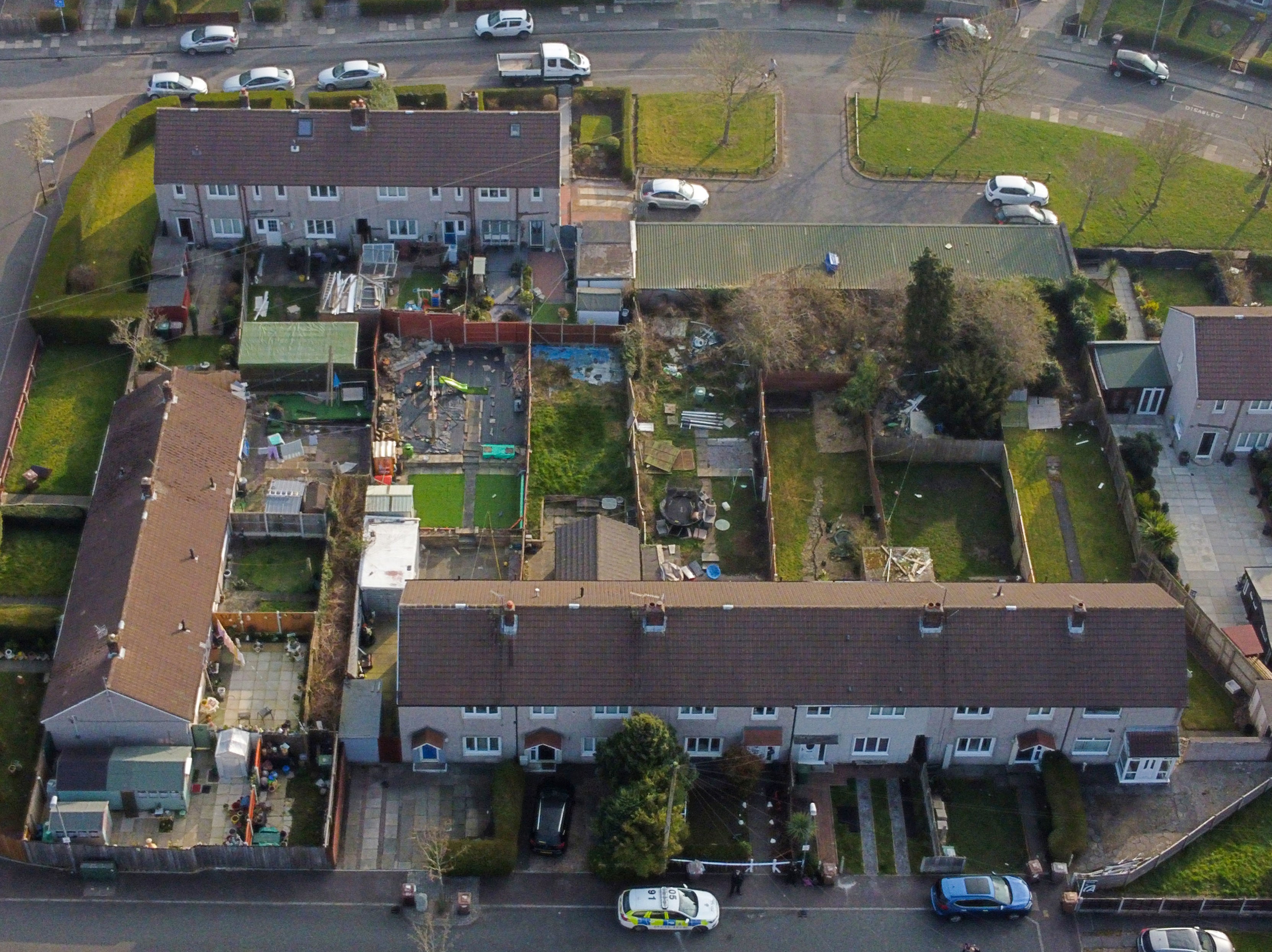 A police car (bottom centre) outside the house in St Helens