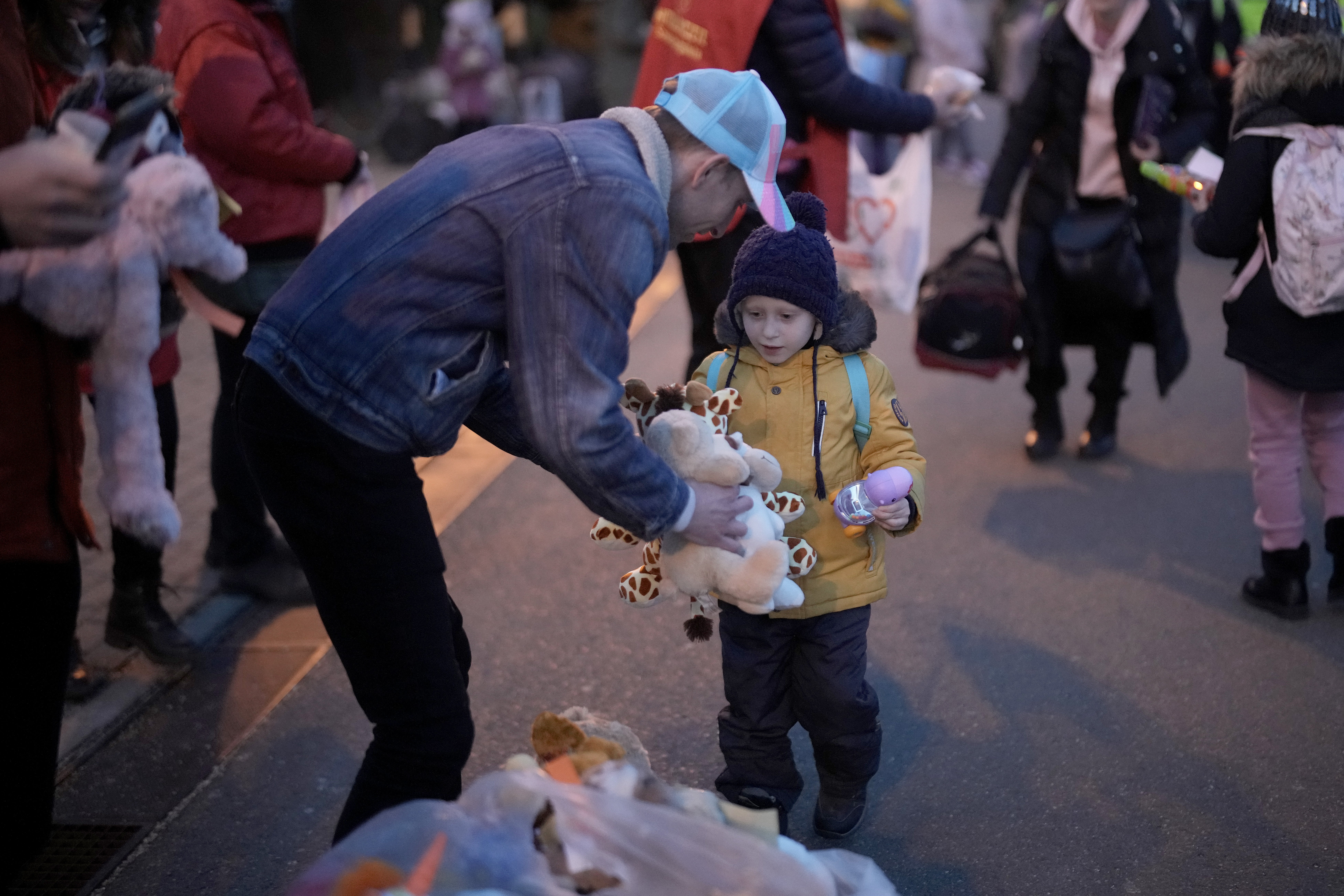 Volunteers from Weston Super Mare in the United Kingdom give away soft toys and teddy bears to refugees fleeing Ukraine as they arrive into Hungary