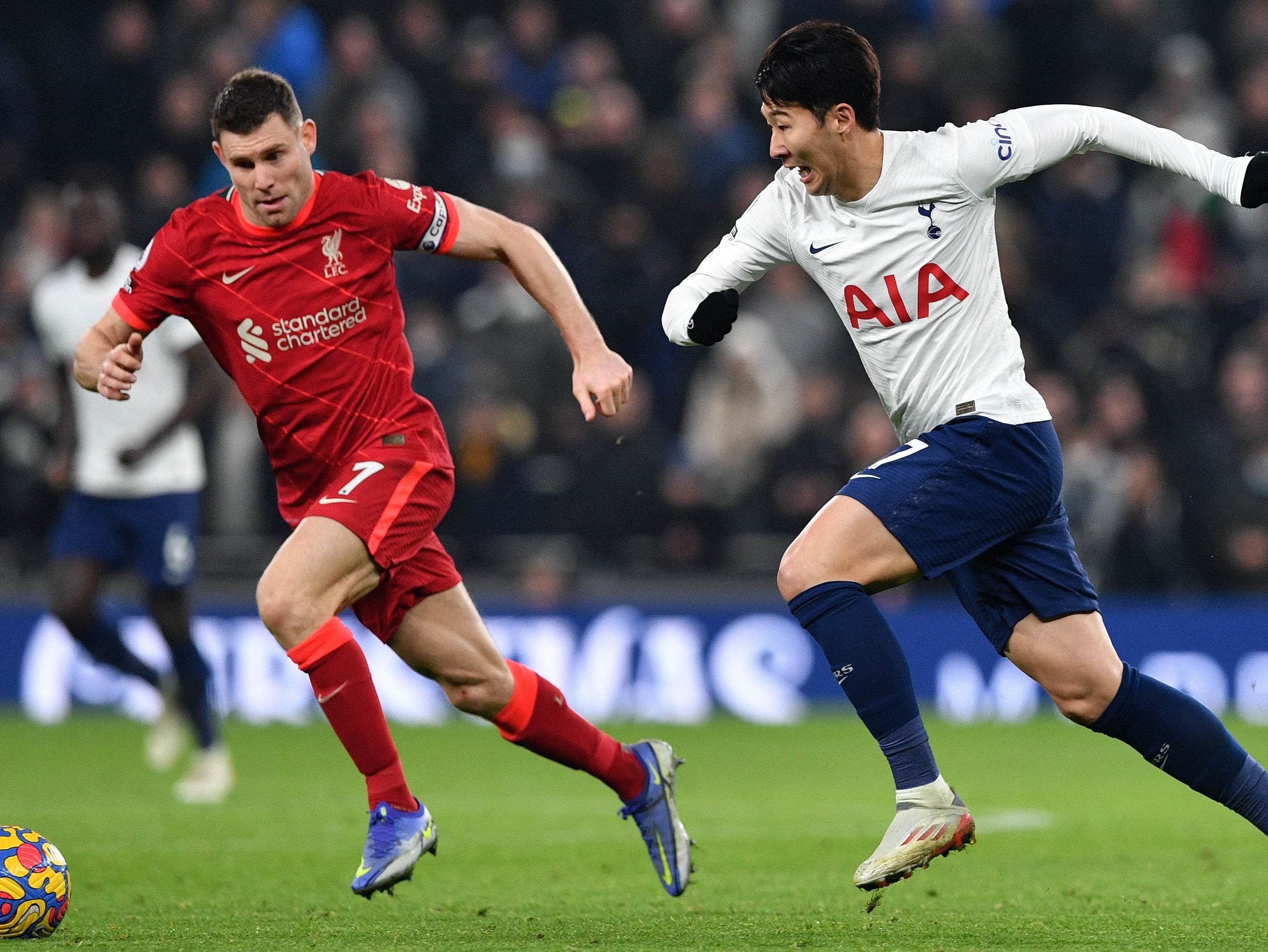 Liverpool’s James Milner chases down Tottenham winger Son Heung-min in December’s fixture