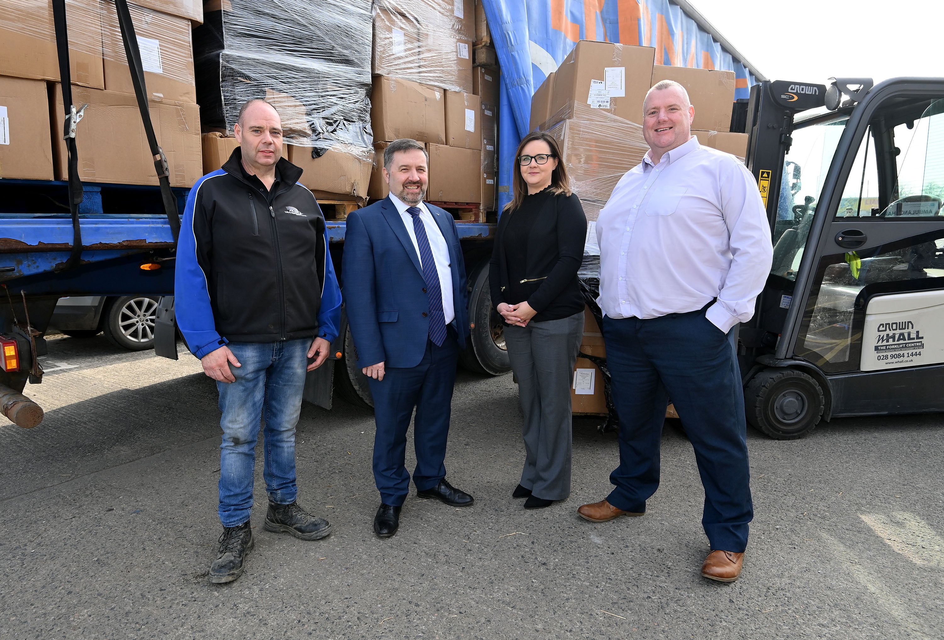 Health Minister Robin Swann with the latest consignment of humanitarian aid which is being donated to Ukraine by the Department of Health. Also pictured are, from left to right, Joe Coyle from Hope 365; Monica Turkington, BSO quality improvement and customer liaison manager; and David McCavana, BSO senior logistics manager (Department of Health/PA)