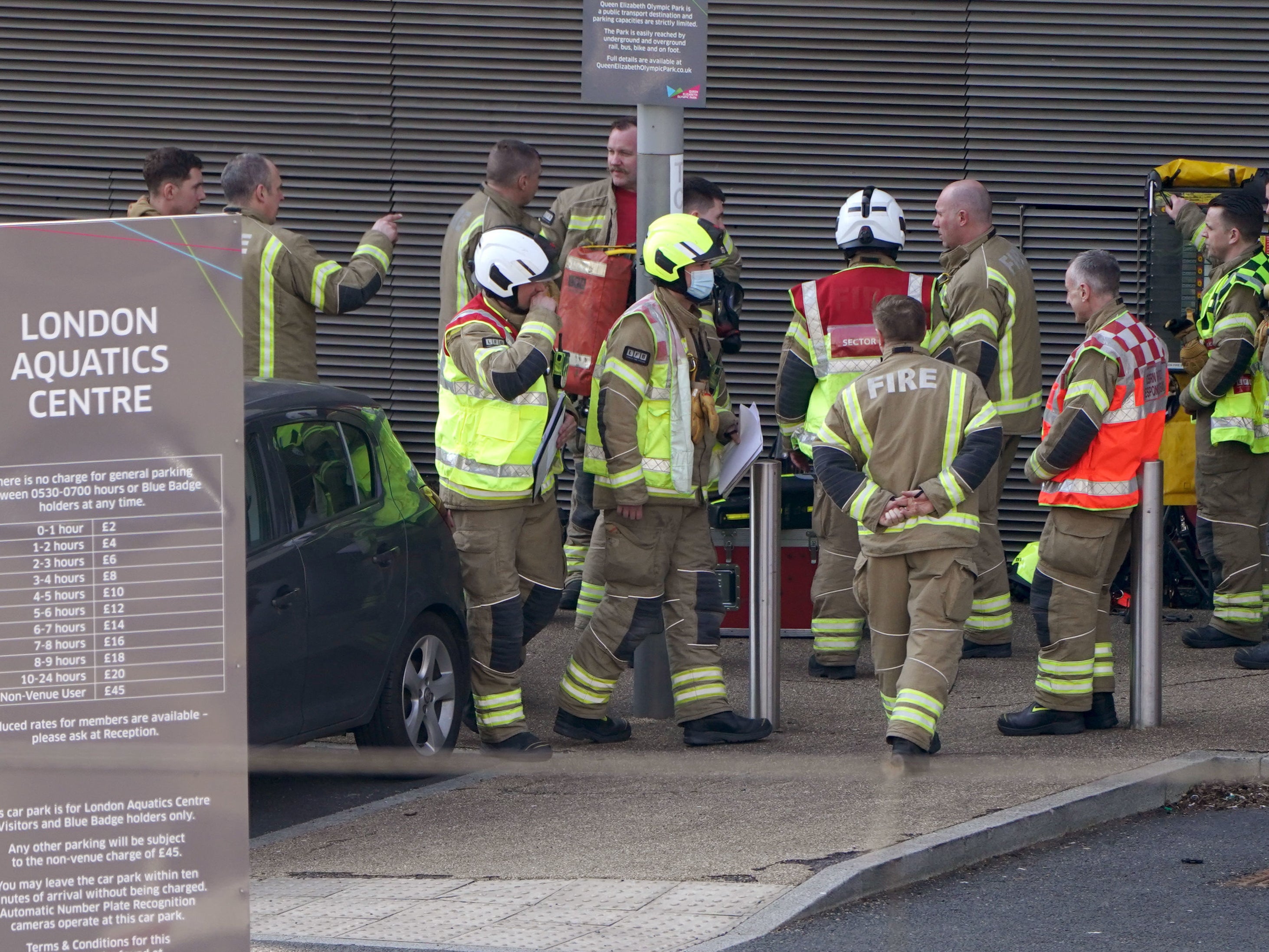 Firefighters outside the Aquatics Centre