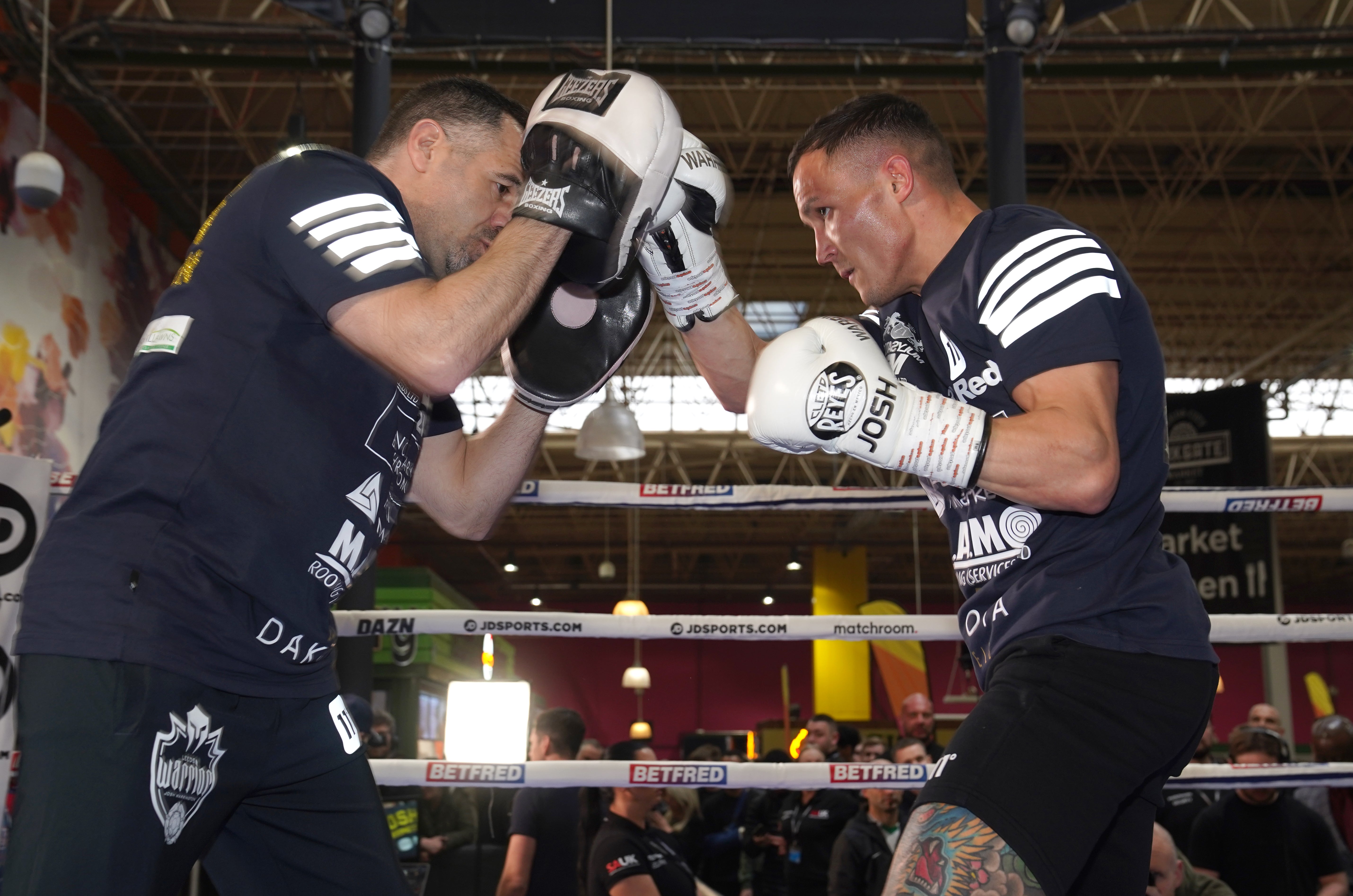 Josh Warrington, right, fights in Leeds on Saturday night (Martin Rickett/PA)