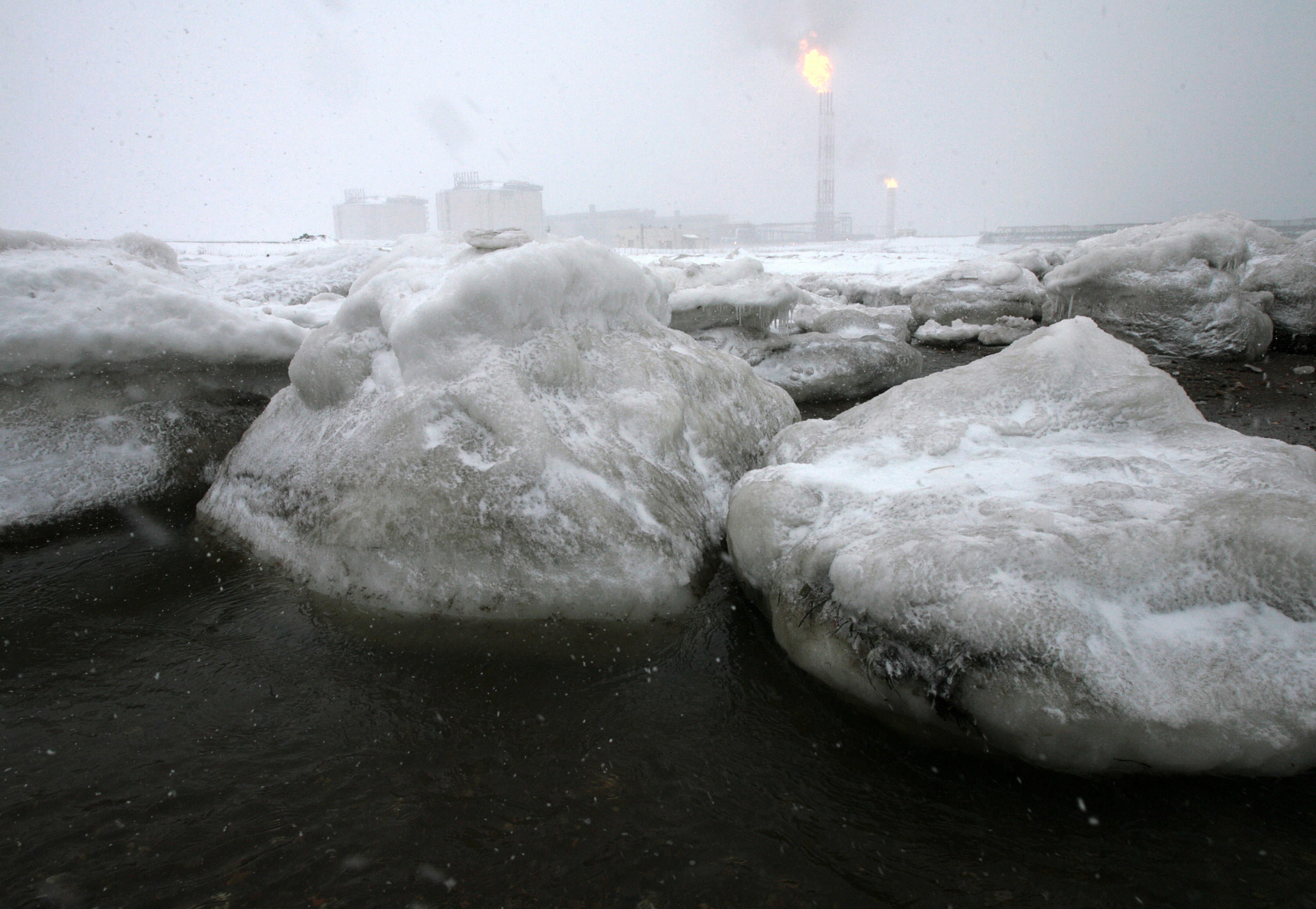 Gas flares off under heavy snowfall at a liquefied natural gas (LNG) plant on Sakhalin island outside the town Korsakov, Russia