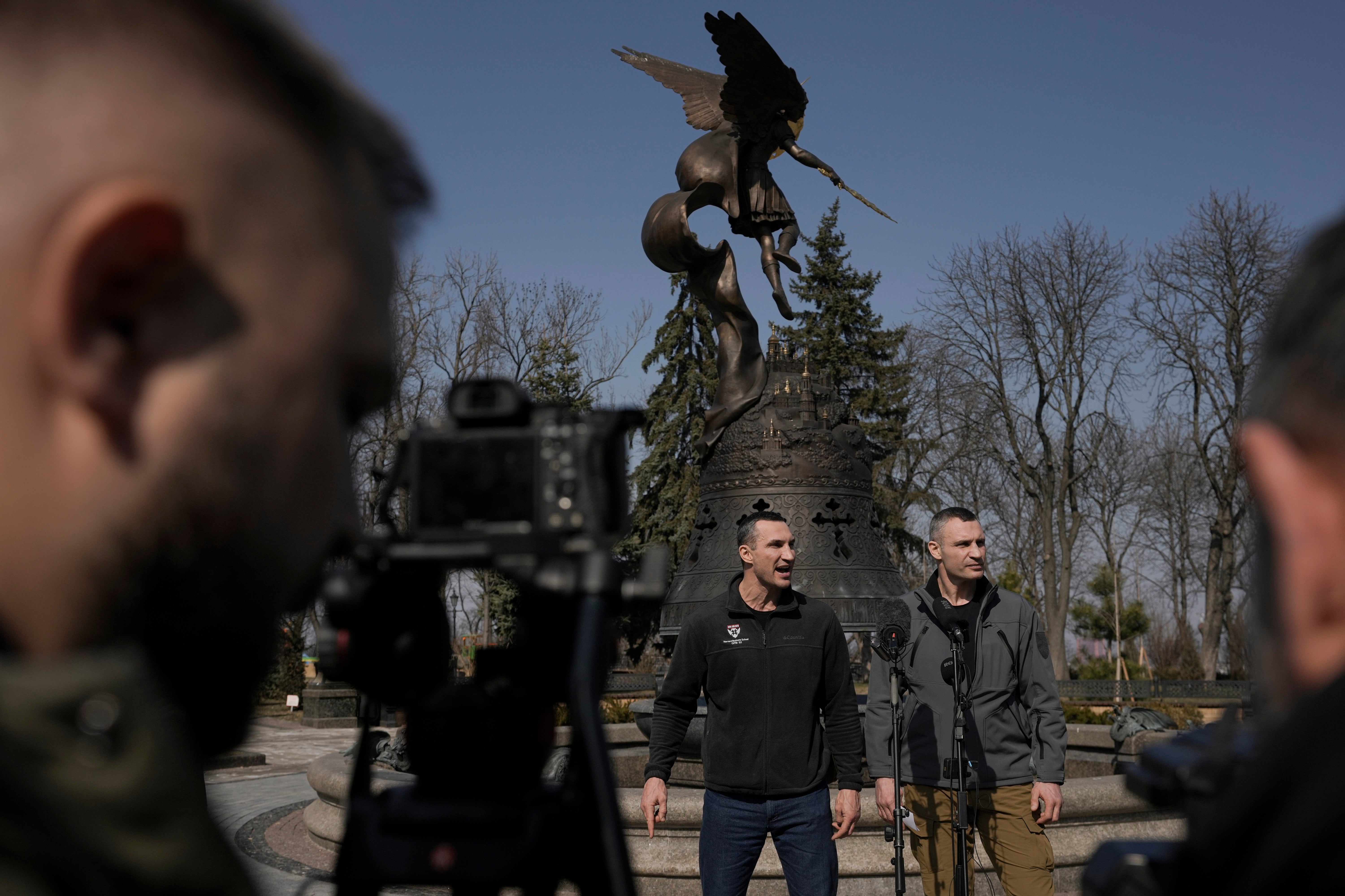 Kyiv Mayor Vitali Klitschko, right, stands next to his brother, former heavyweight boxing world champion Wladimir Klitschko, during a press conference, in Kyiv