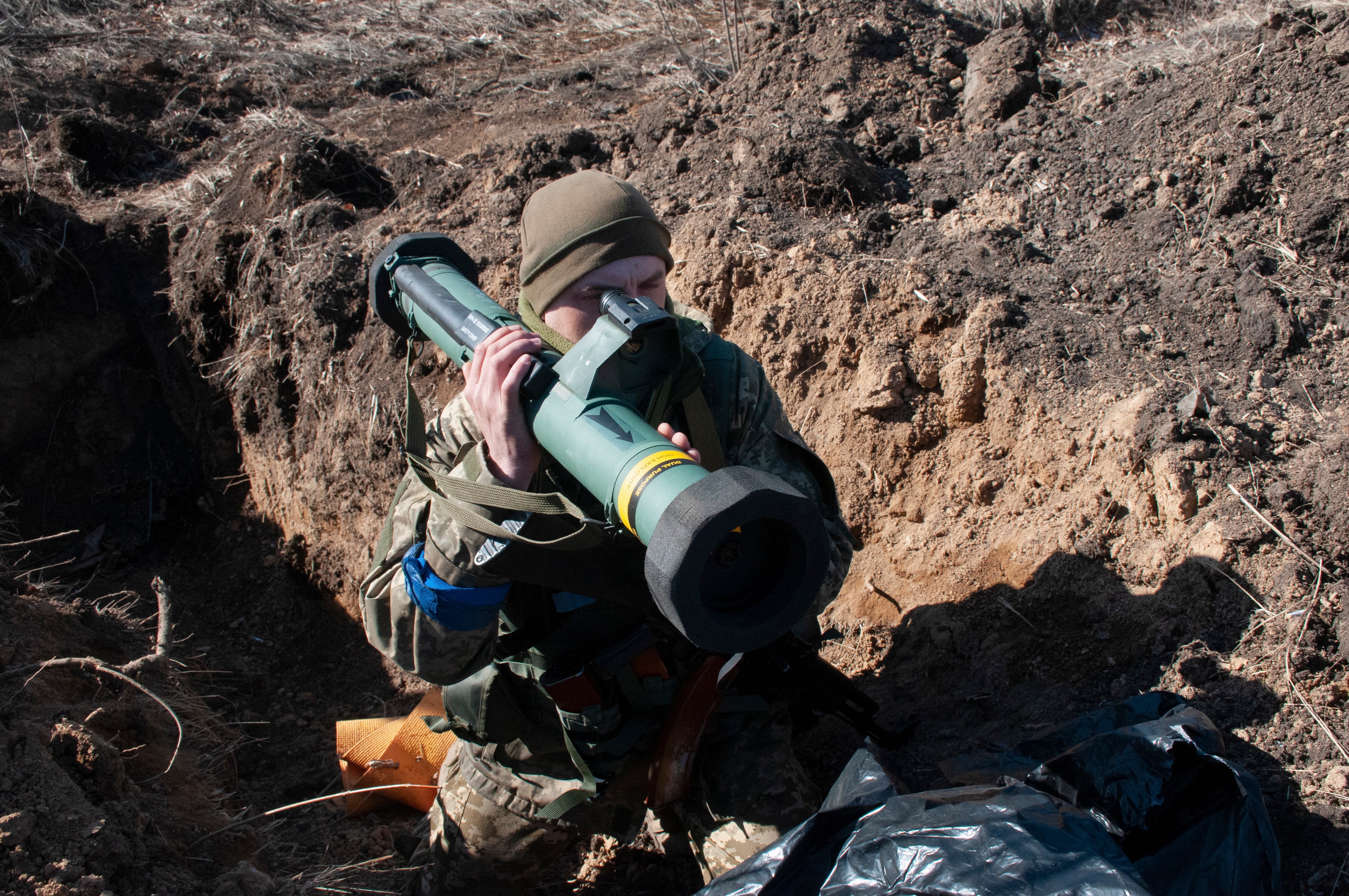 Ukrainian servicemen attend their positions in Kharkiv,