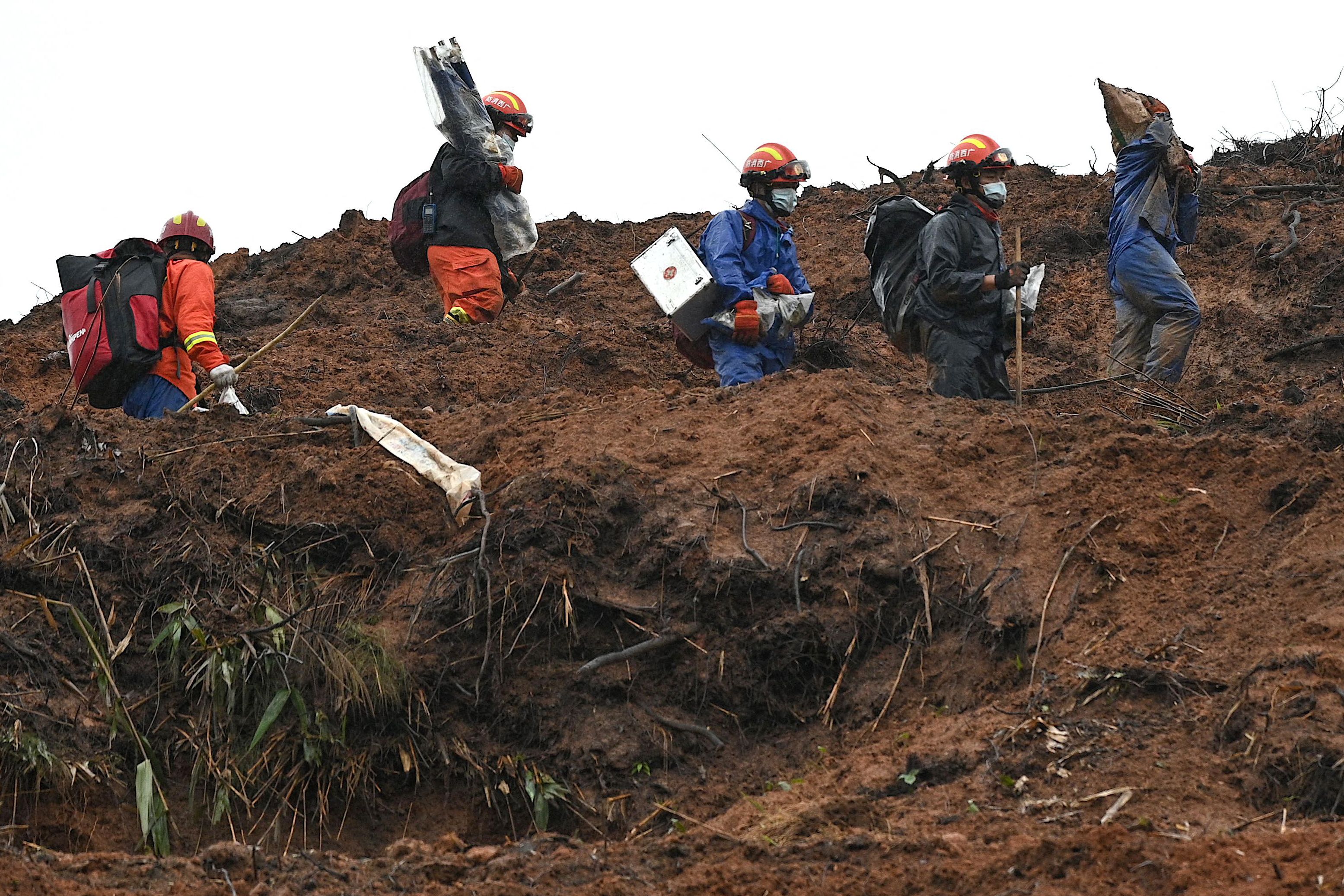 China plane crash: Search teams find key parts of downed jet - but still seek second black box