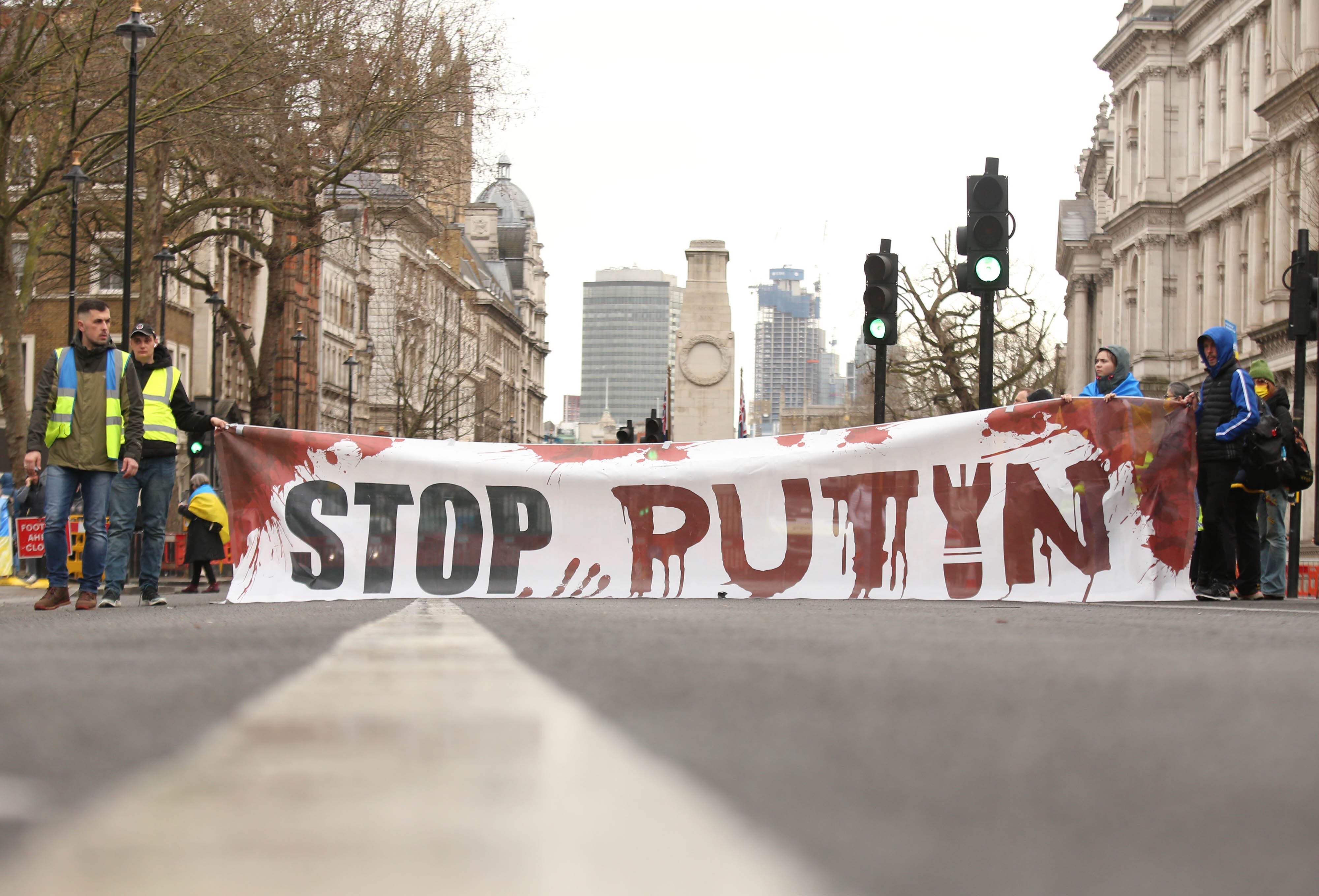 People attend a demonstration outside Downing Street, London, to show solidarity with Ukraine following the invasion by Russia (James Manning/PA)