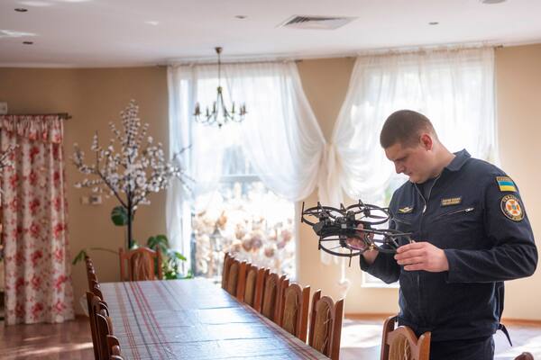 Yurii Shevchenko, a pilot with the Ukrainian Emergency Service, examines a Lemur drone at a training workshop organized by Brinc, a Seattle-based drone maker