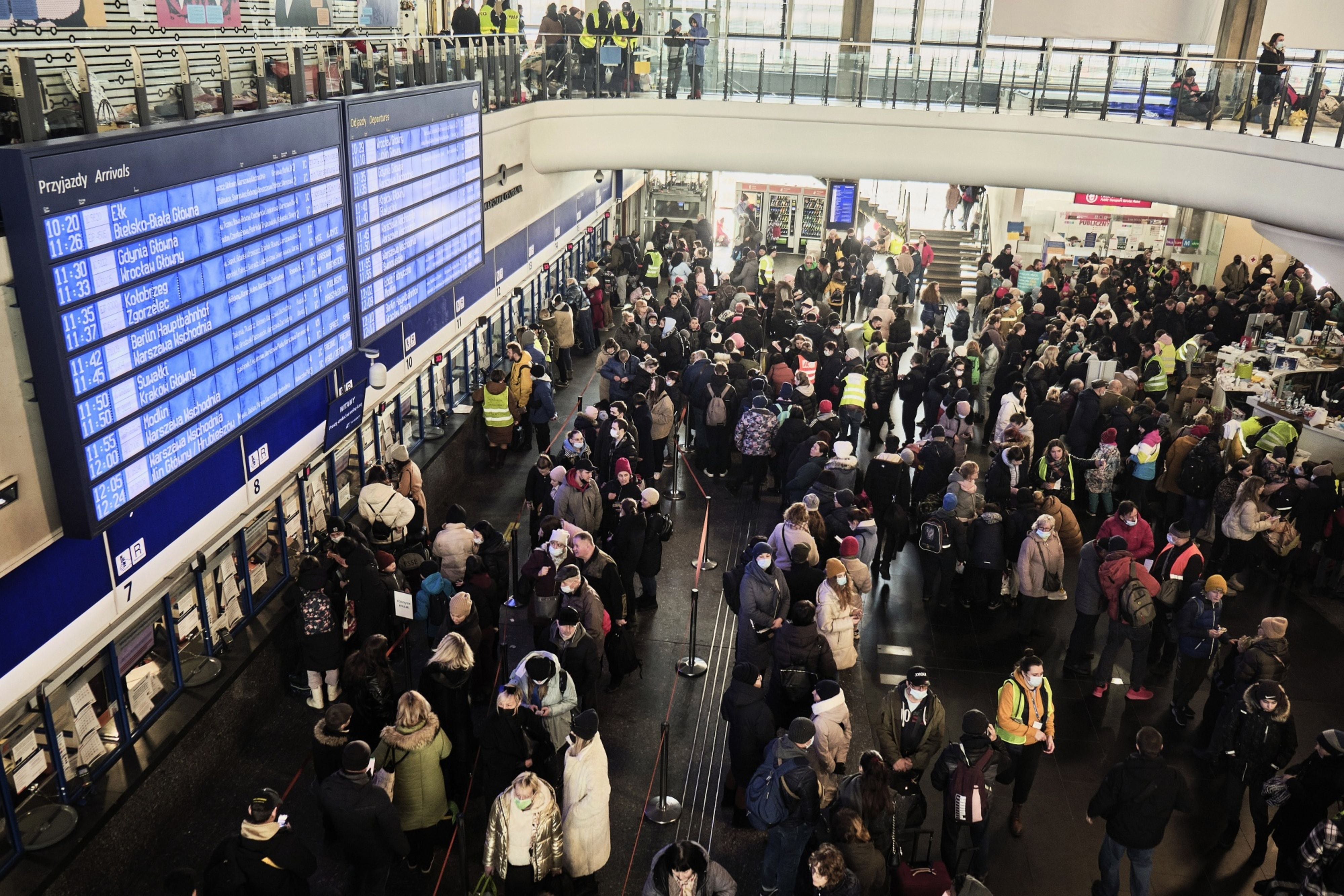 Displaced Ukrainians queue at ticket counters in the main hall at Warsaw Central railway station