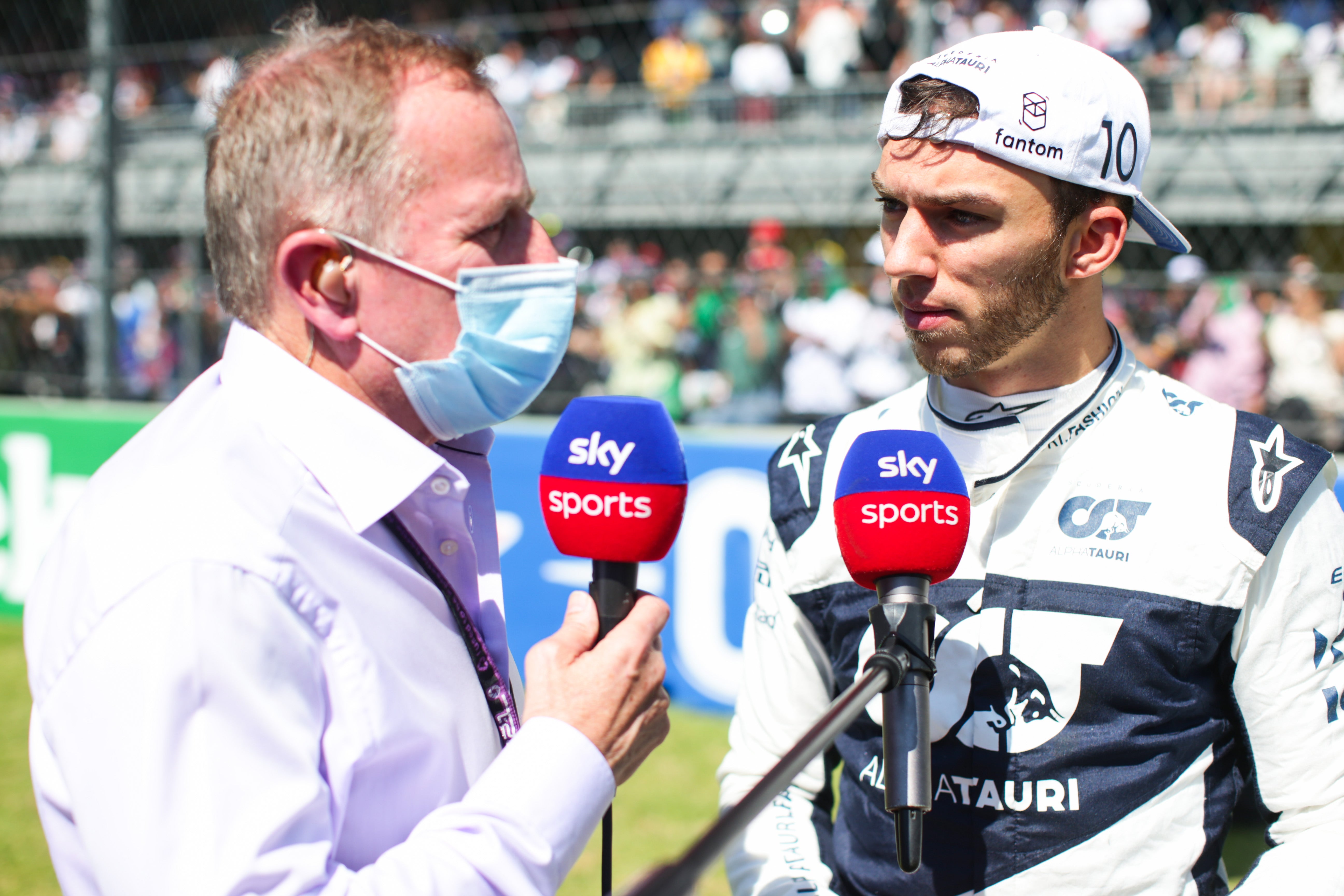 Brundle, left, speaking to driver Pierre Gasly