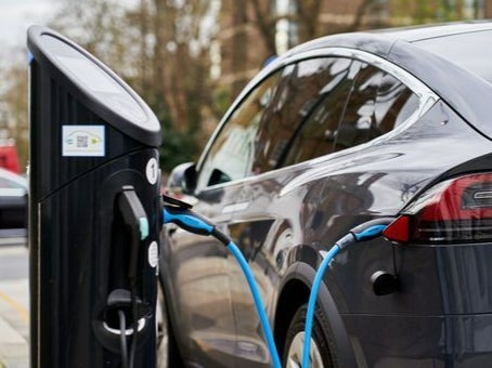 The government said Friday it will help businesses to roll out 300,000 public electric car charge points by 2030.