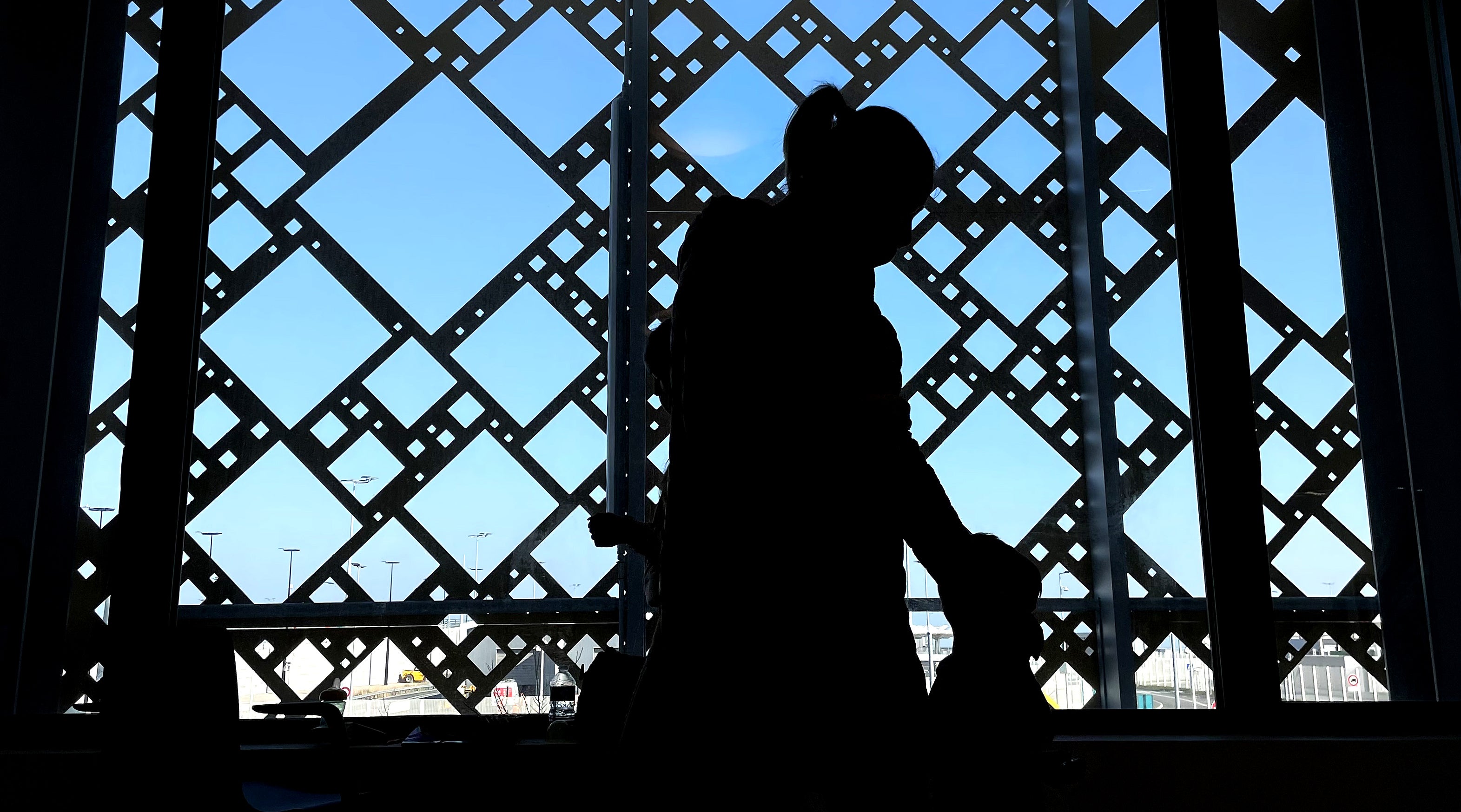 A Ukrainian family waits for paperwork to be completed at the ferry terminal in Calais, France (Gareth Fuller/PA)