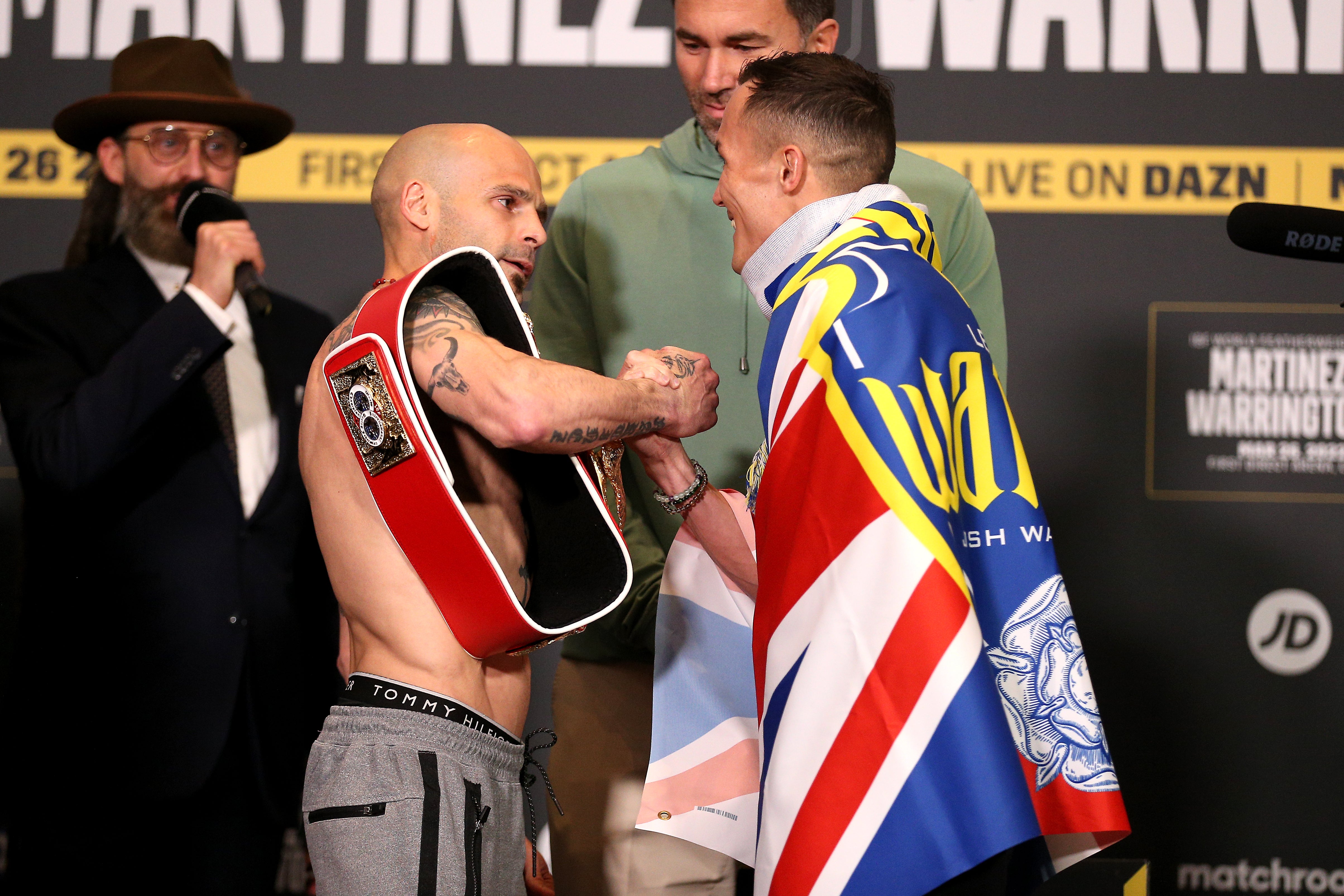 Josh Warrington, right, and Kiko Martinez, left, shook hands after a heated face-off