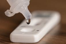 What does a faint line mean on a lateral flow test?