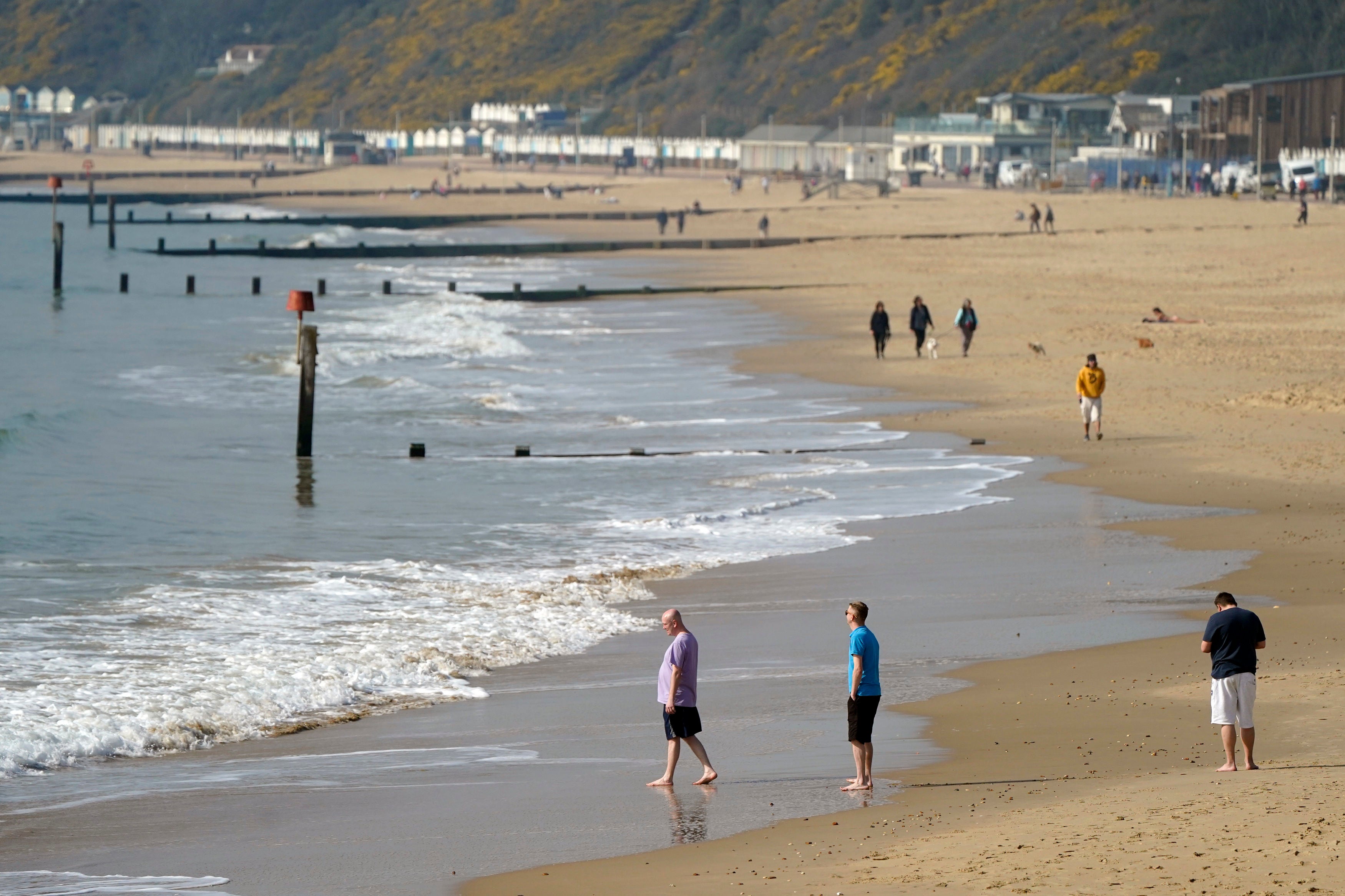 People enjoy the warm weather on Bournemouth beach in Dorset