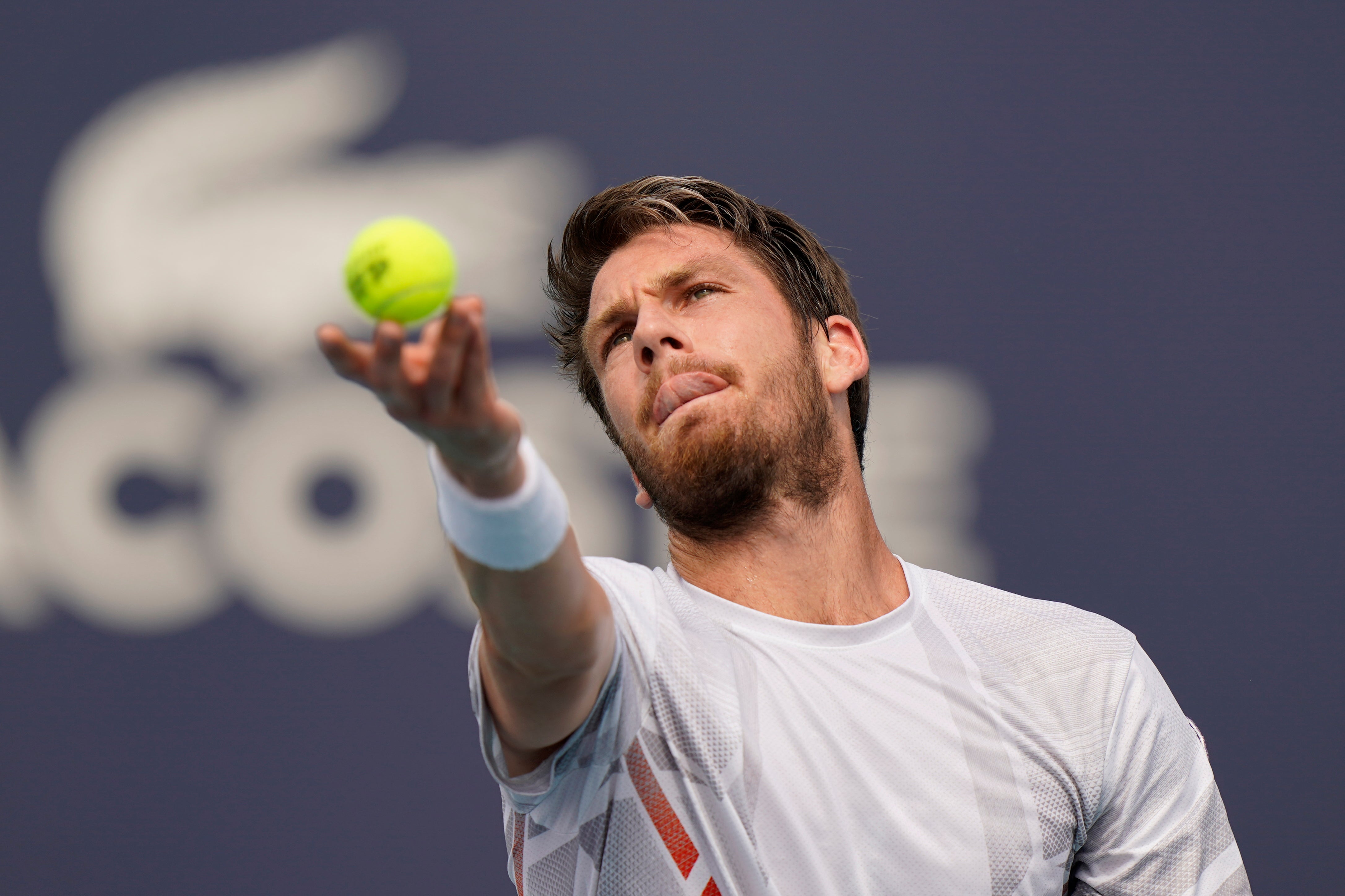 Cameron Norrie serves to Jack Draper, both of Great Britain, during the Miami Open tennis tournament on Friday (Wilfredo Lee/AP)