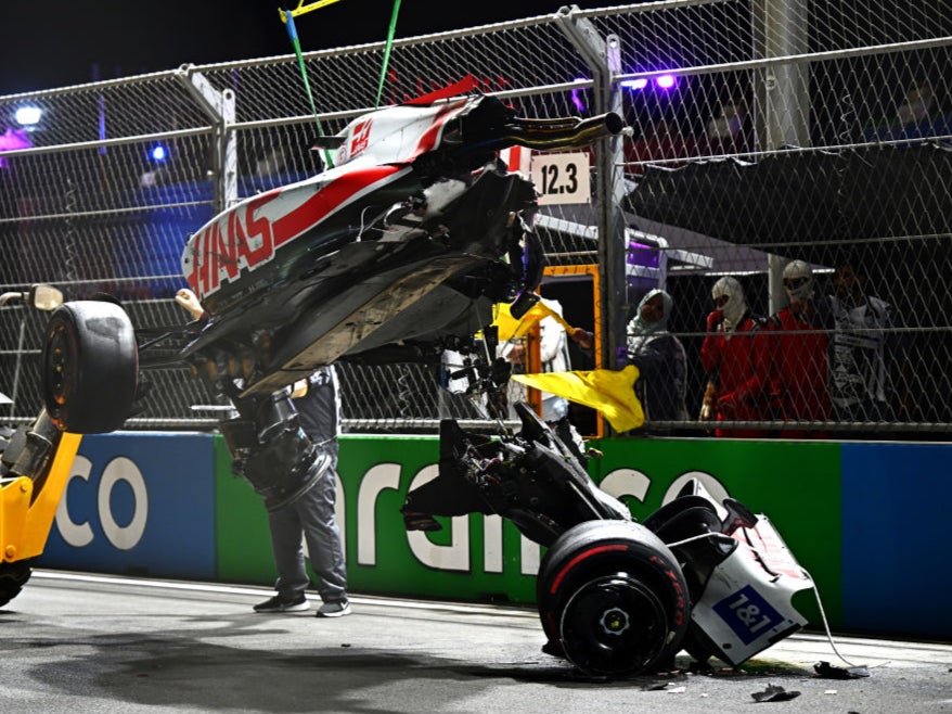 Mick Schumacher’s car is lifted off the track