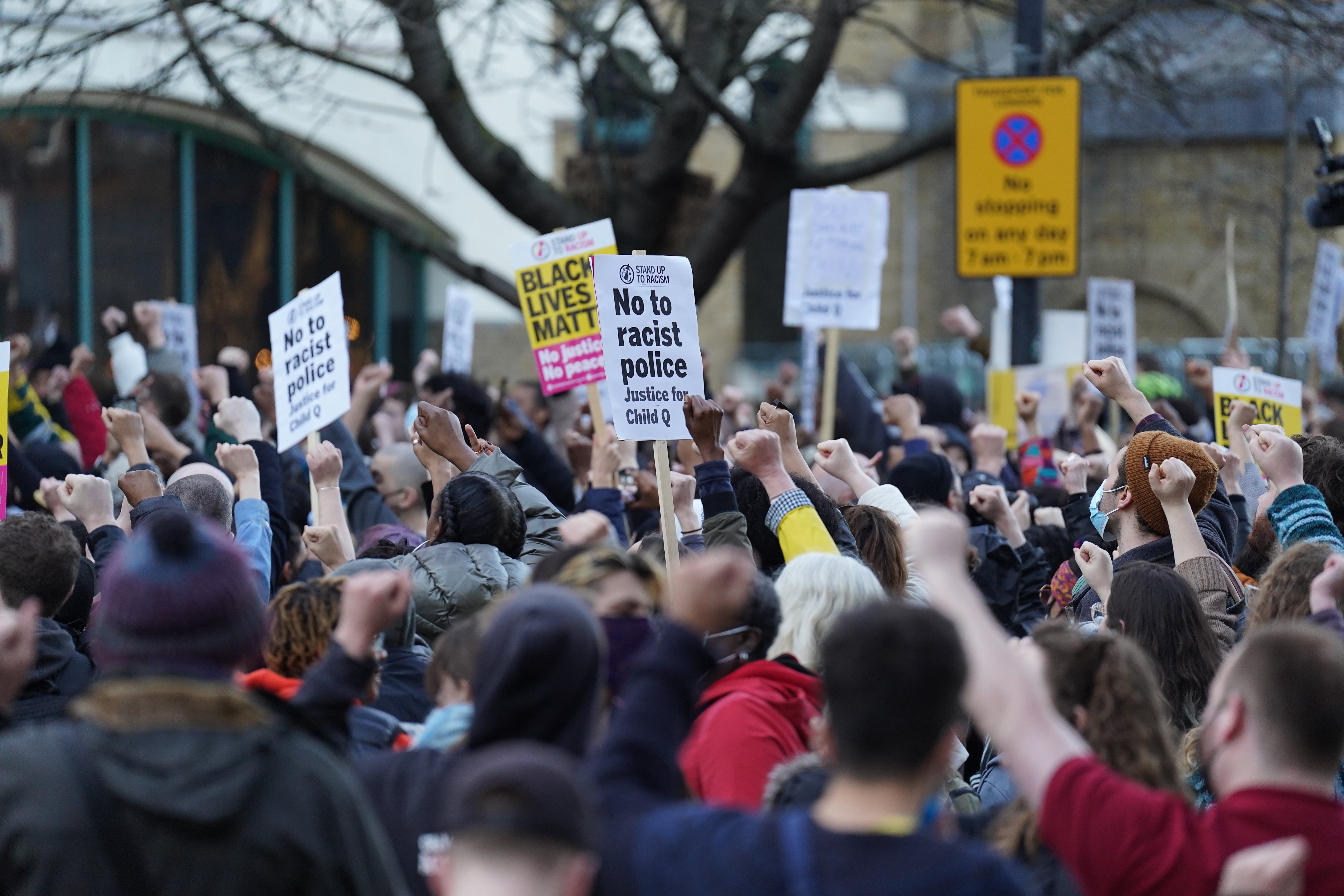 People demonstrate outside Stoke Newington Police Station (PA)