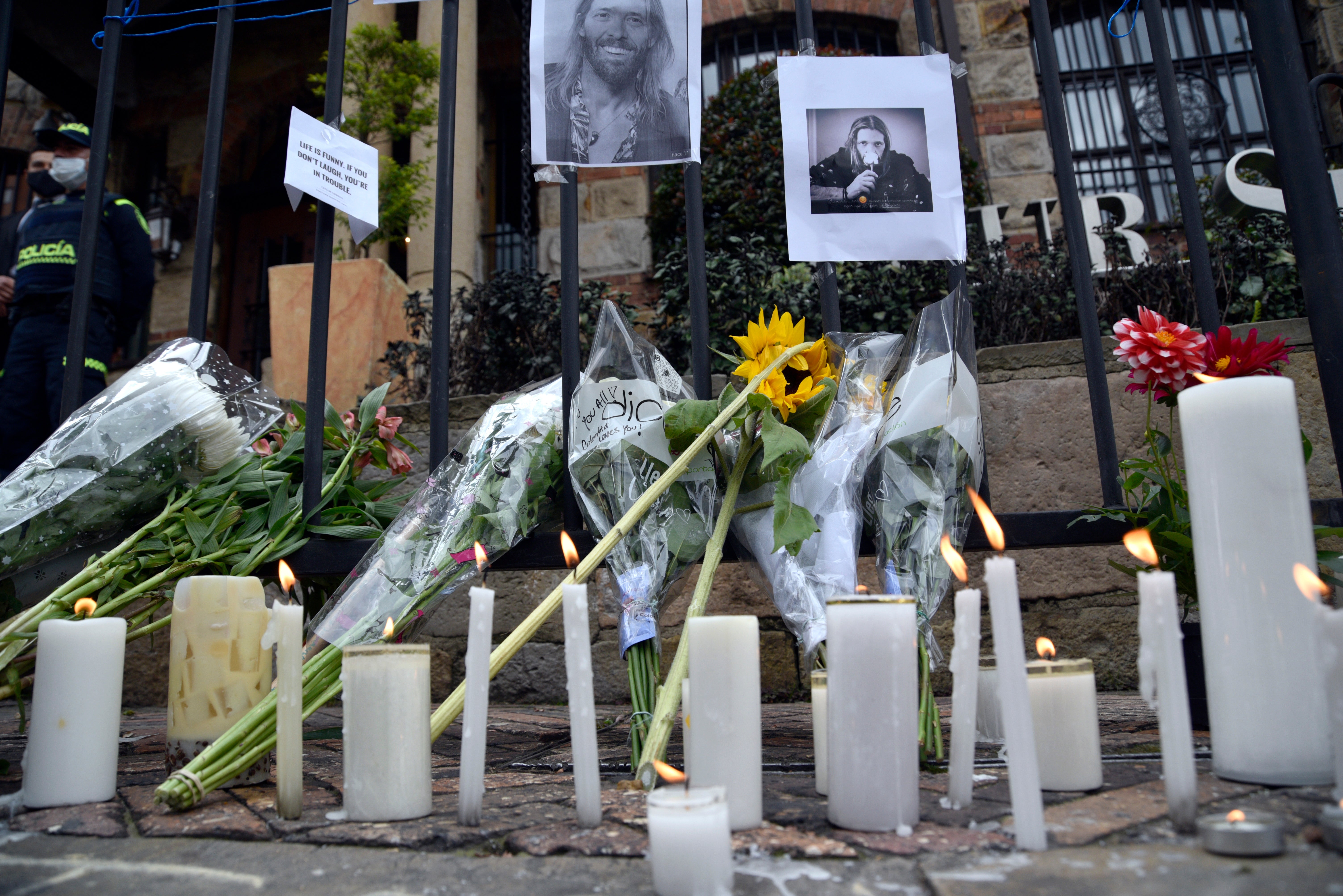 Fans lay flowers outside Casa Medina Hotel, where Hawkins was found dead