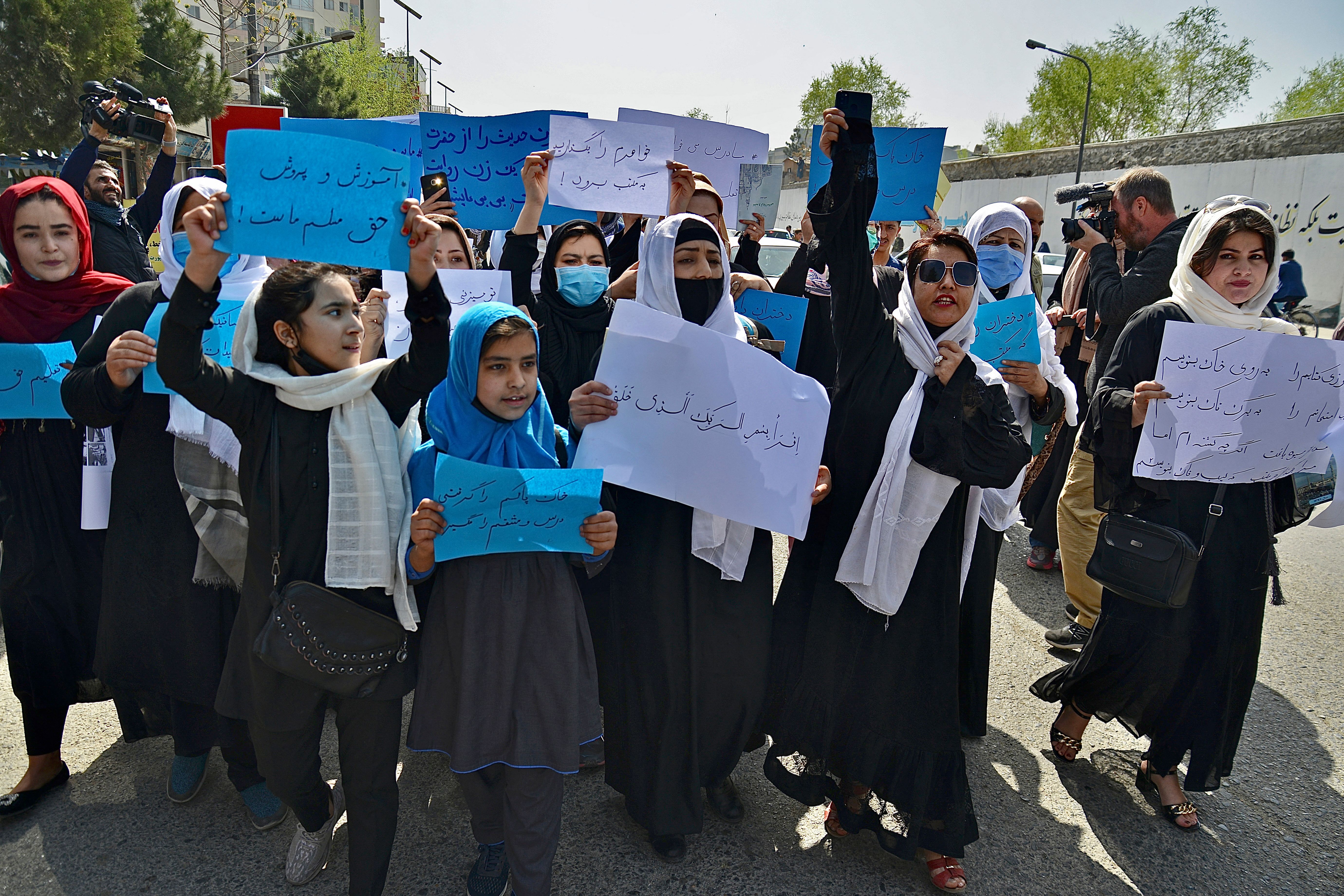 Afghan women and girls take part in a protest in front of the Ministry of Education in Kabul