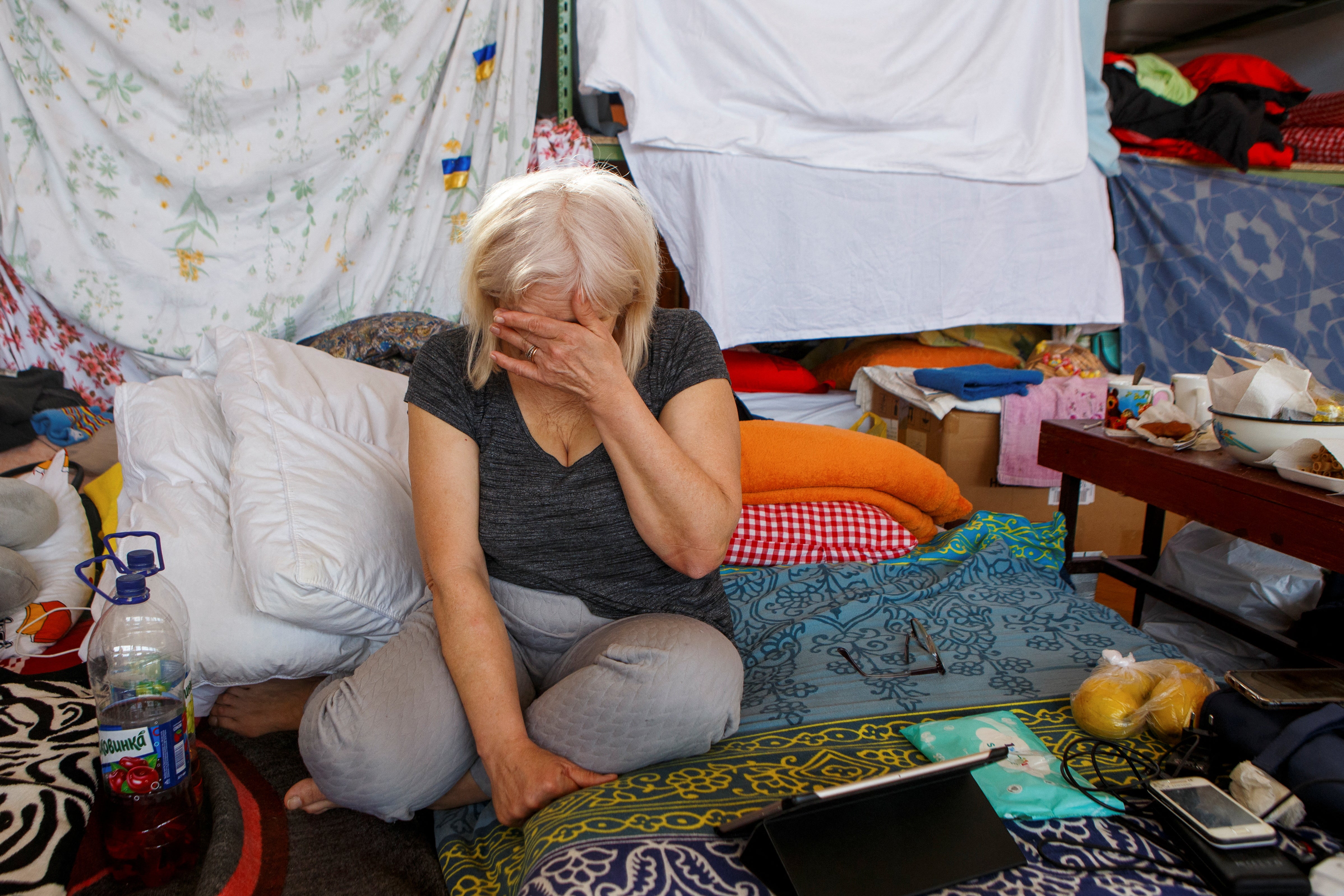 Nadiya Kyrylenko, from Luhansk, takes refuge at a school gym in Uzhgorod, Ukraine