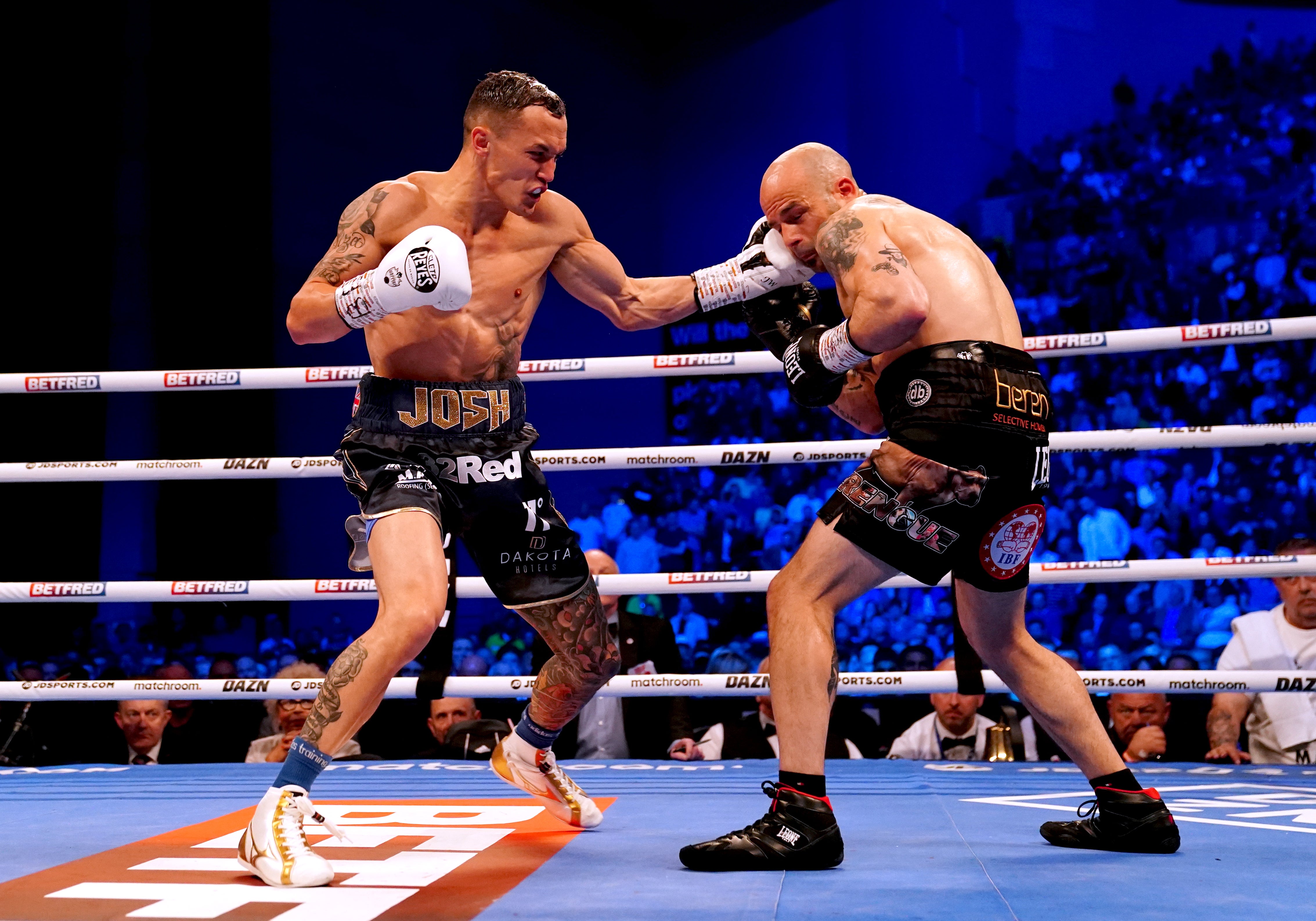 Josh Warrington (left) stopped Spain’s Kiko Martinez in the seventh round (Martin Rickett/PA)