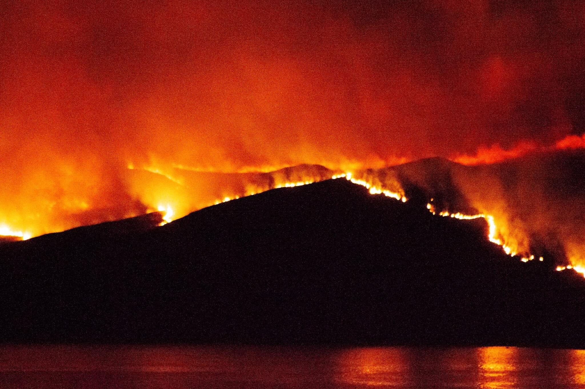 Both ends of the island were engulfed by flames witnesses said